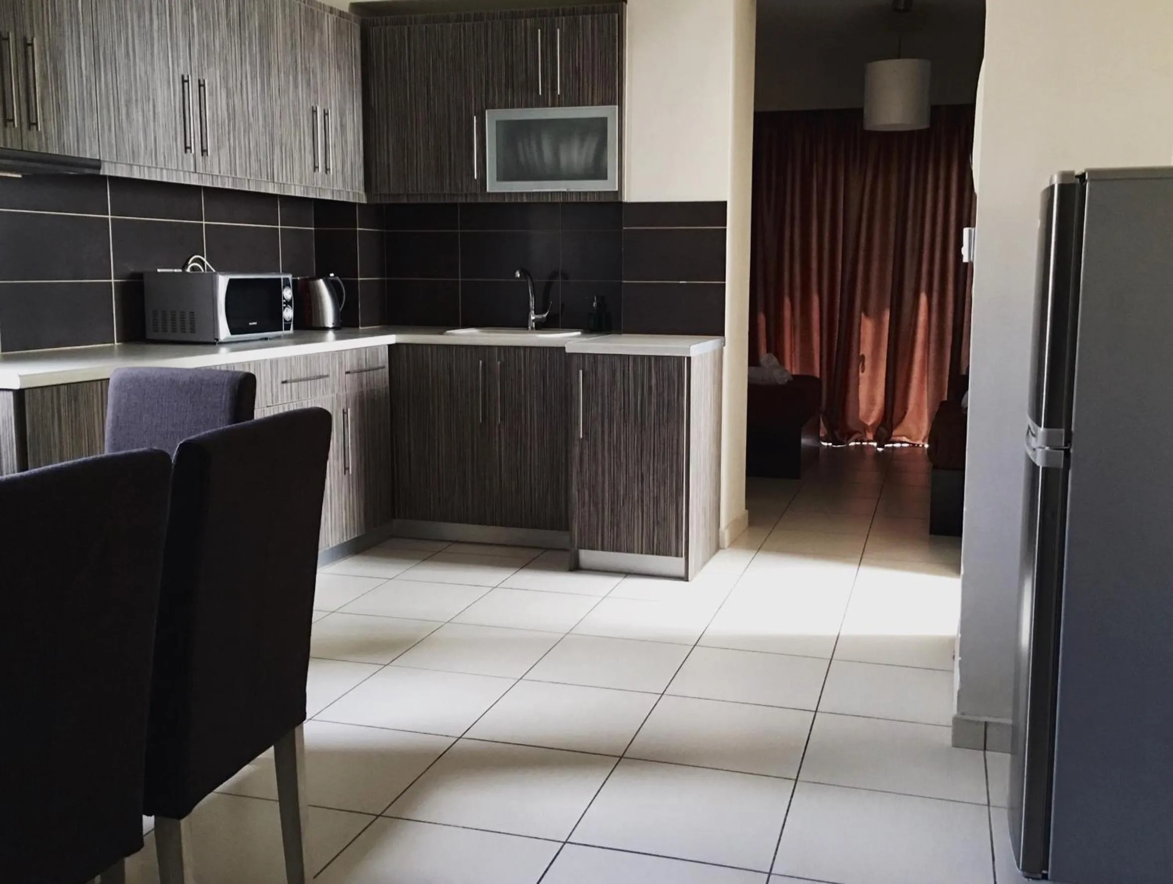 Kitchen or kitchenette in Mc Queen Rooms & Apartments