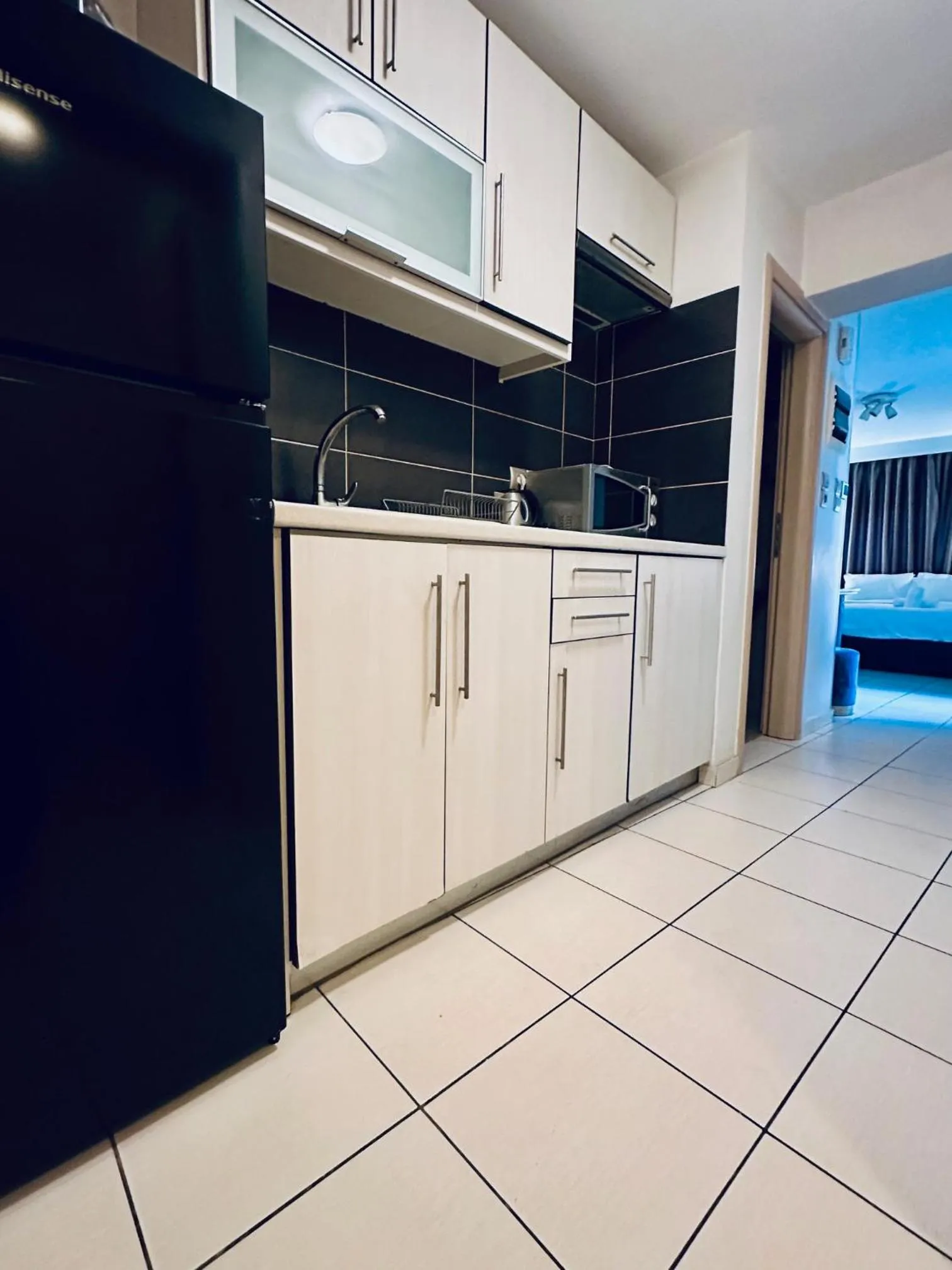 Kitchen or kitchenette in Mc Queen Rooms & Apartments