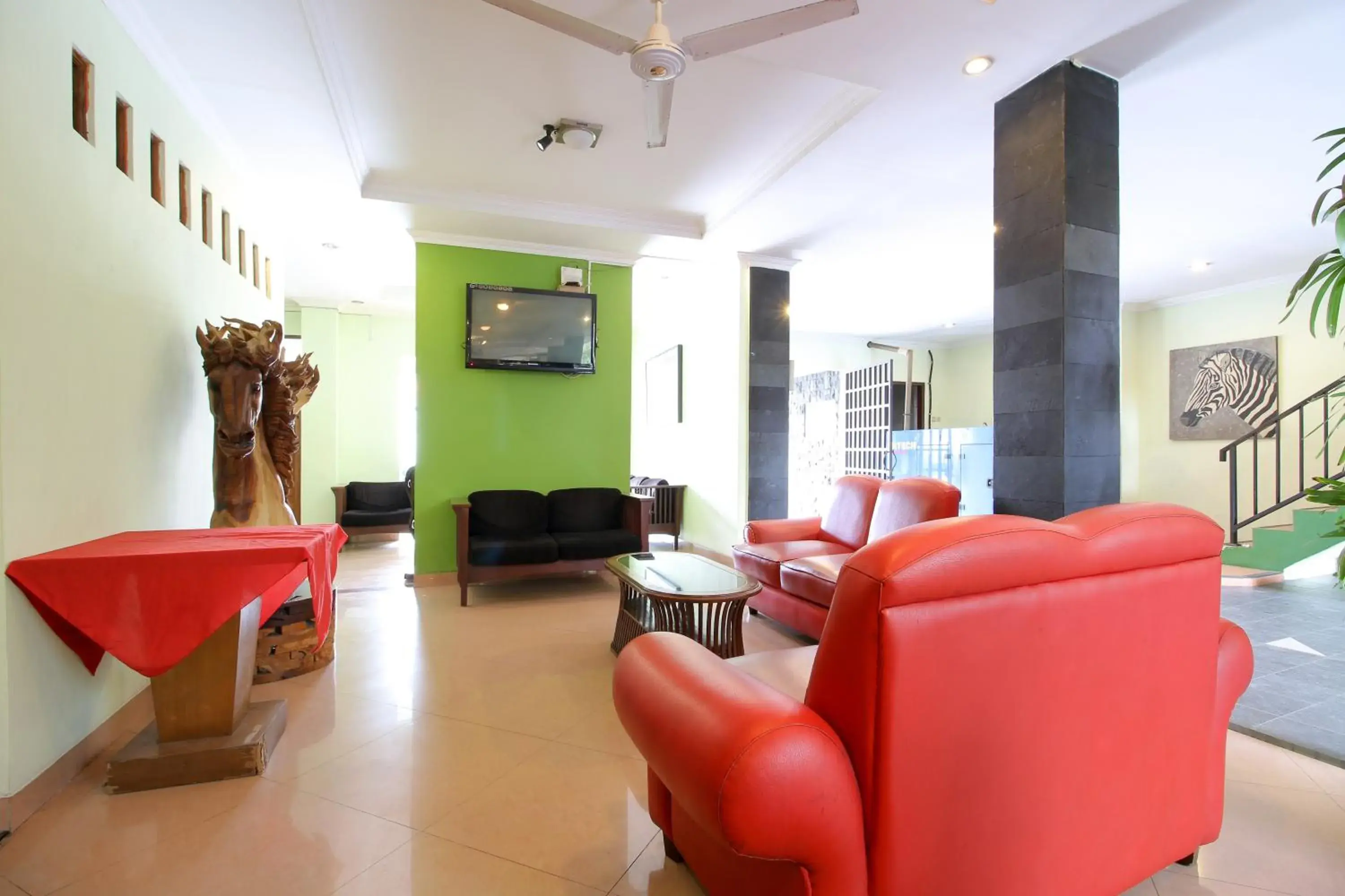 Living room in RedDoorz Plus @ Taman Siswa 2 Living room in RedDoorz Plus @ Taman Siswa 2