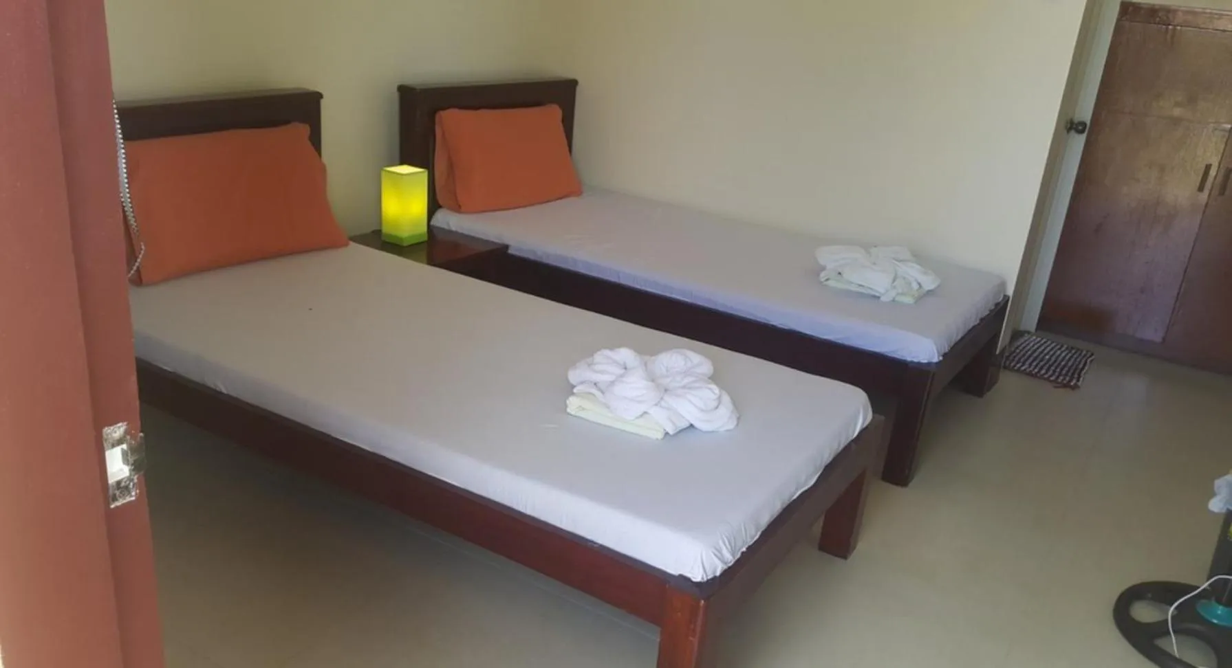 Bed in SLAM'S Garden Dive Resort
