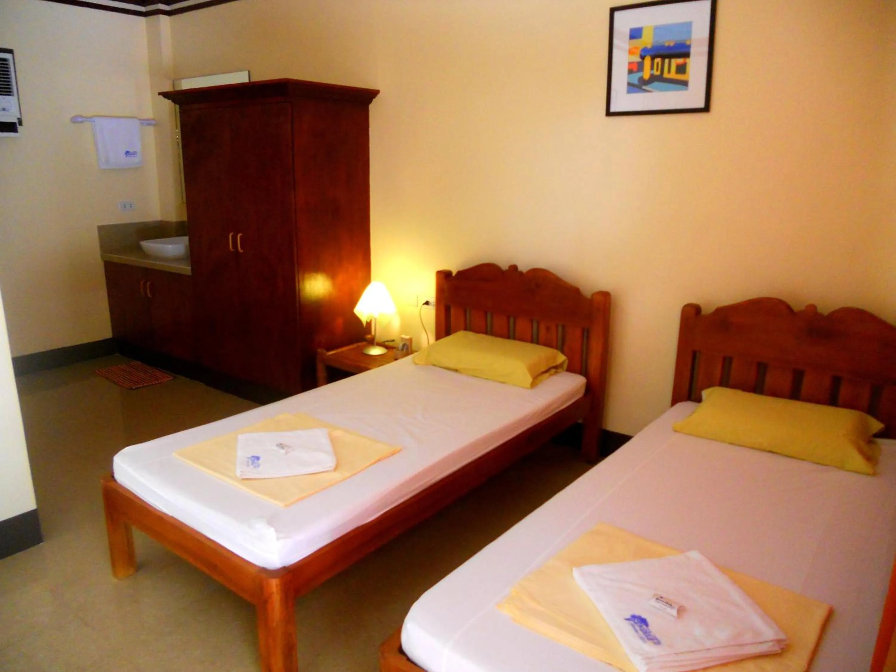 Bed in SLAM'S Garden Dive Resort