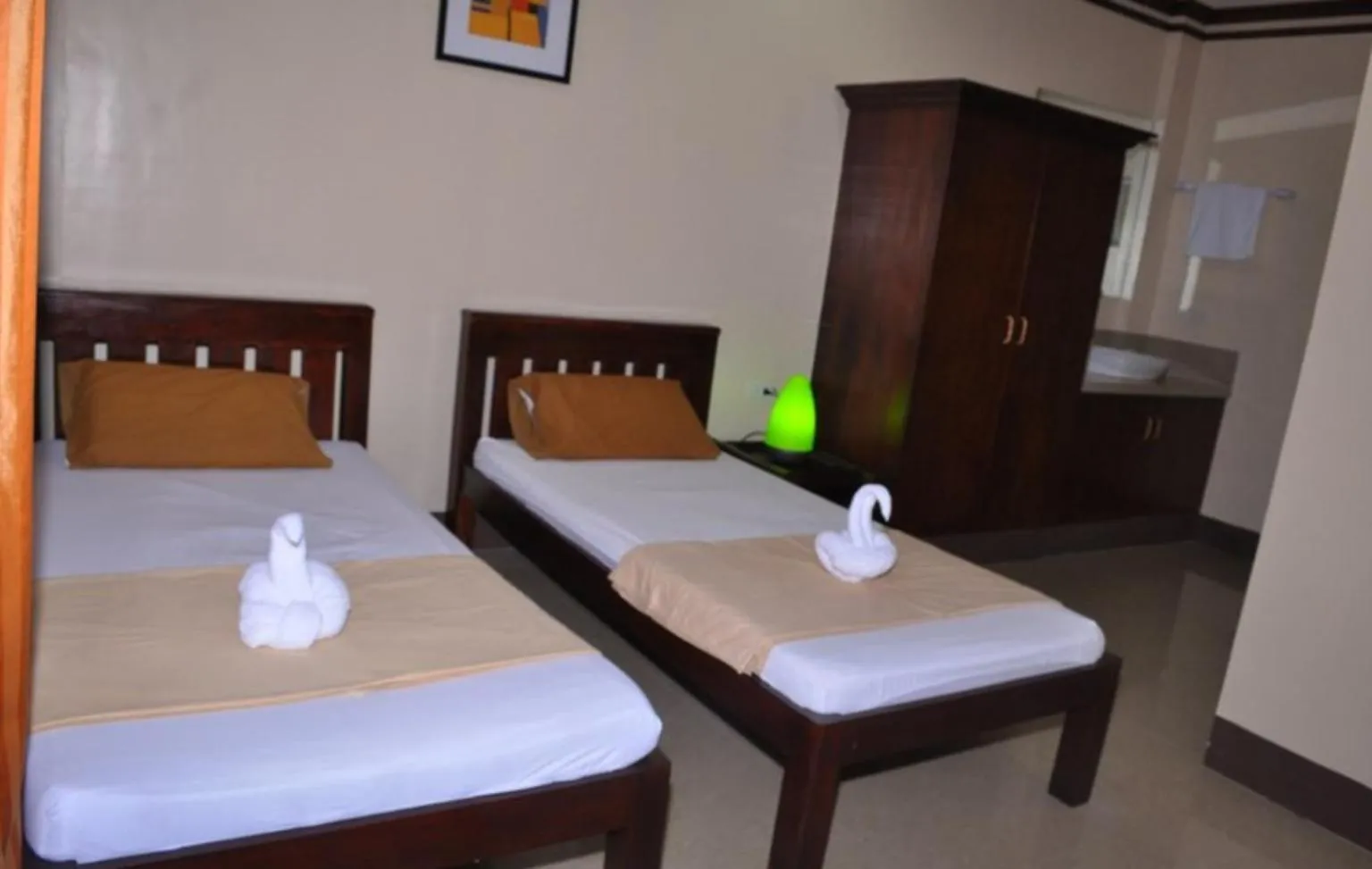 Bed in SLAM'S Garden Dive Resort