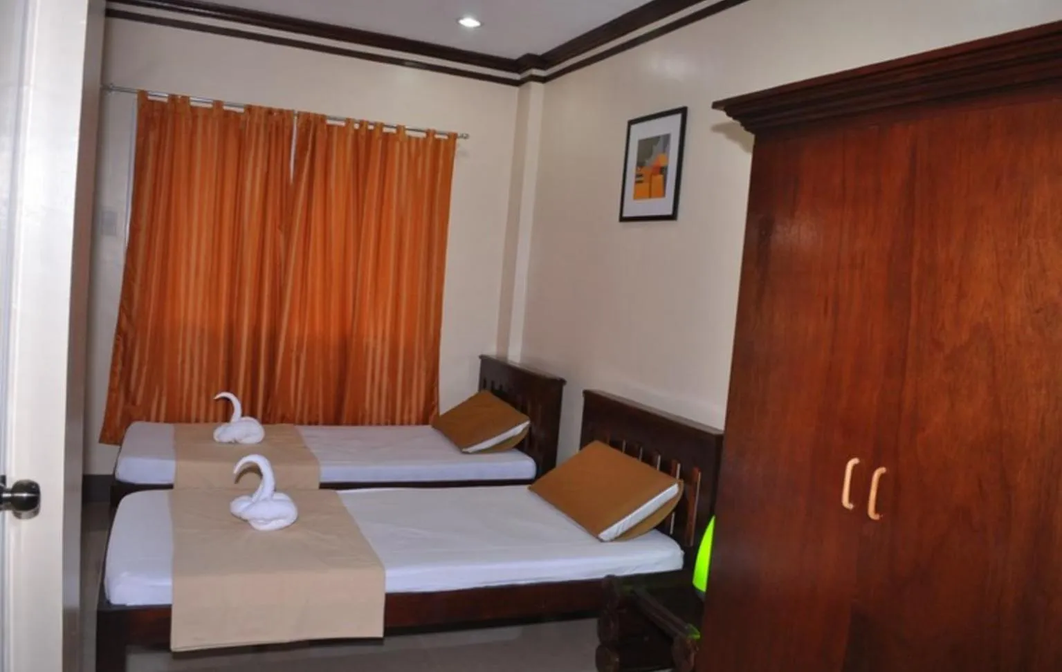 Bed in SLAM'S Garden Dive Resort