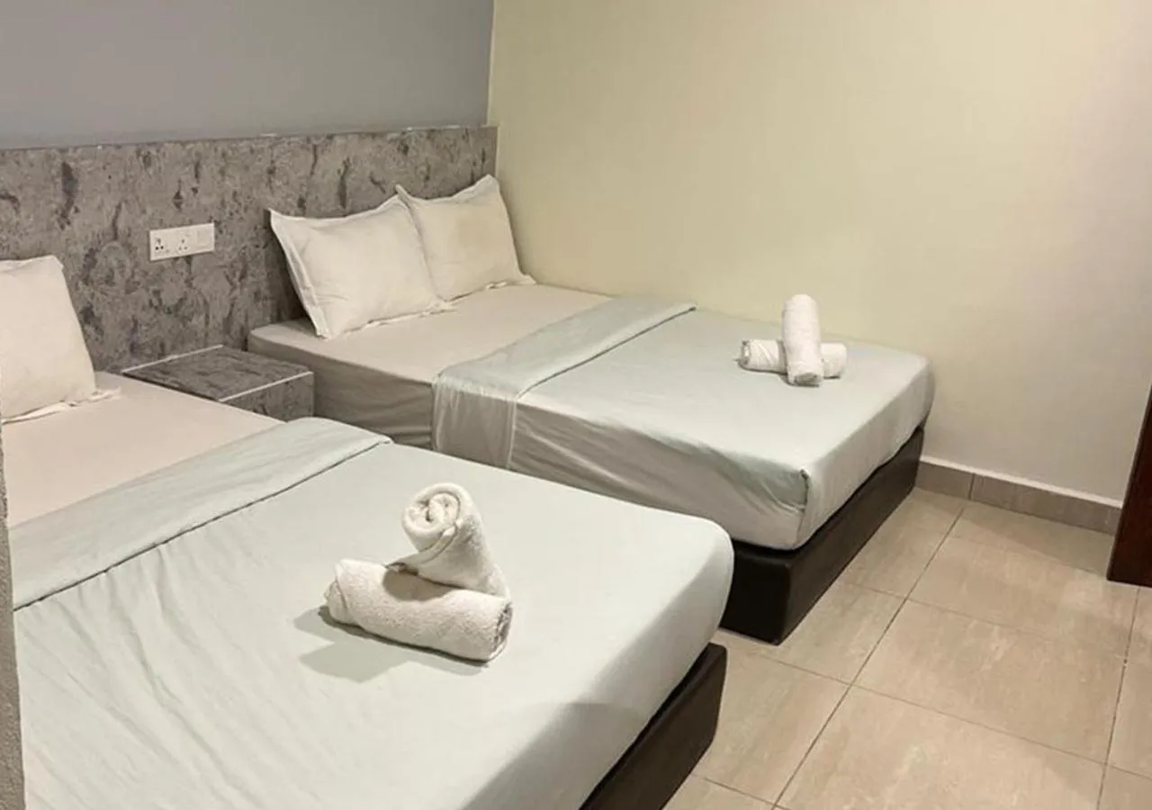 Bed in D'Lima Beach Inn