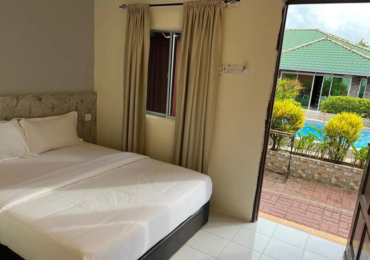 Garden view, Bed in D'Lima Beach Inn