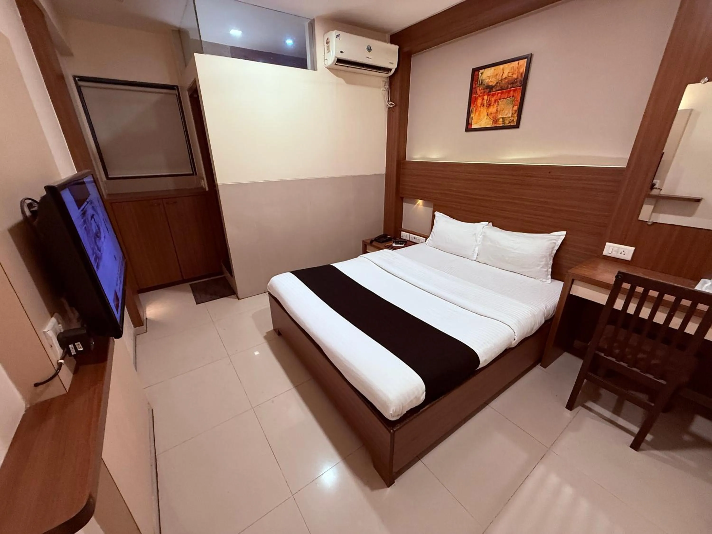 Bed in Hotel Alka Residency