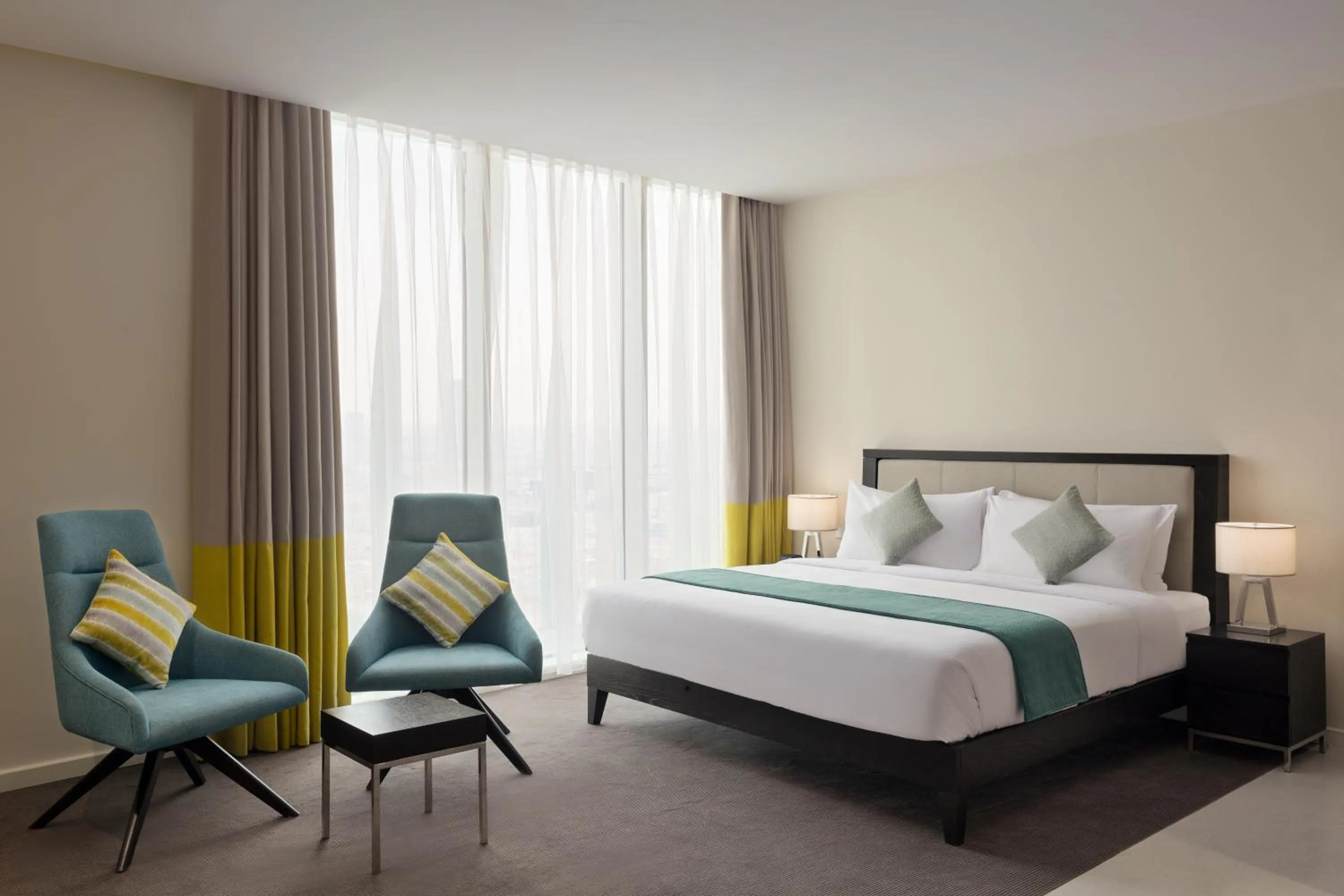 Photo of the whole room, Bed in Staybridge Suites Al Khobar by IHG