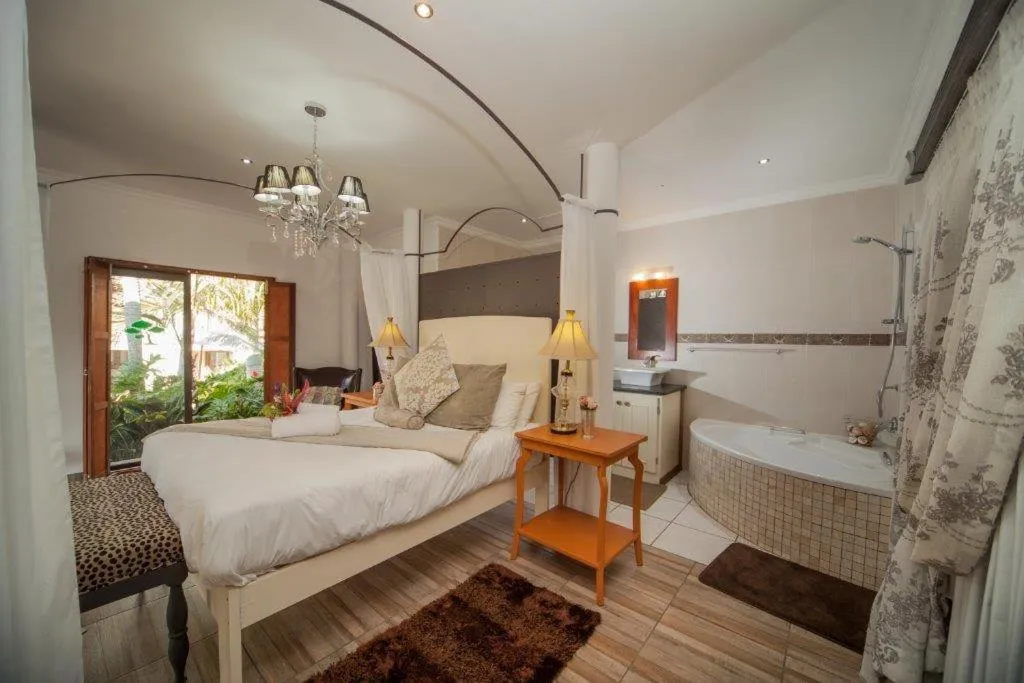 Bed in Tamboti Lodge Guest House