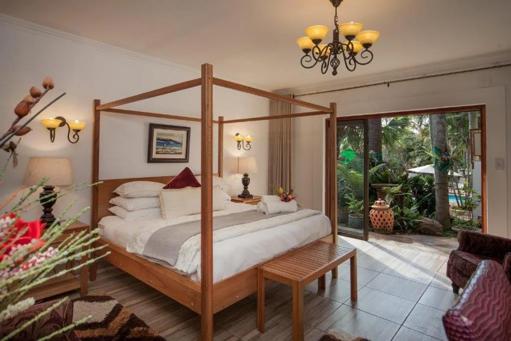 Bed in Tamboti Lodge Guest House