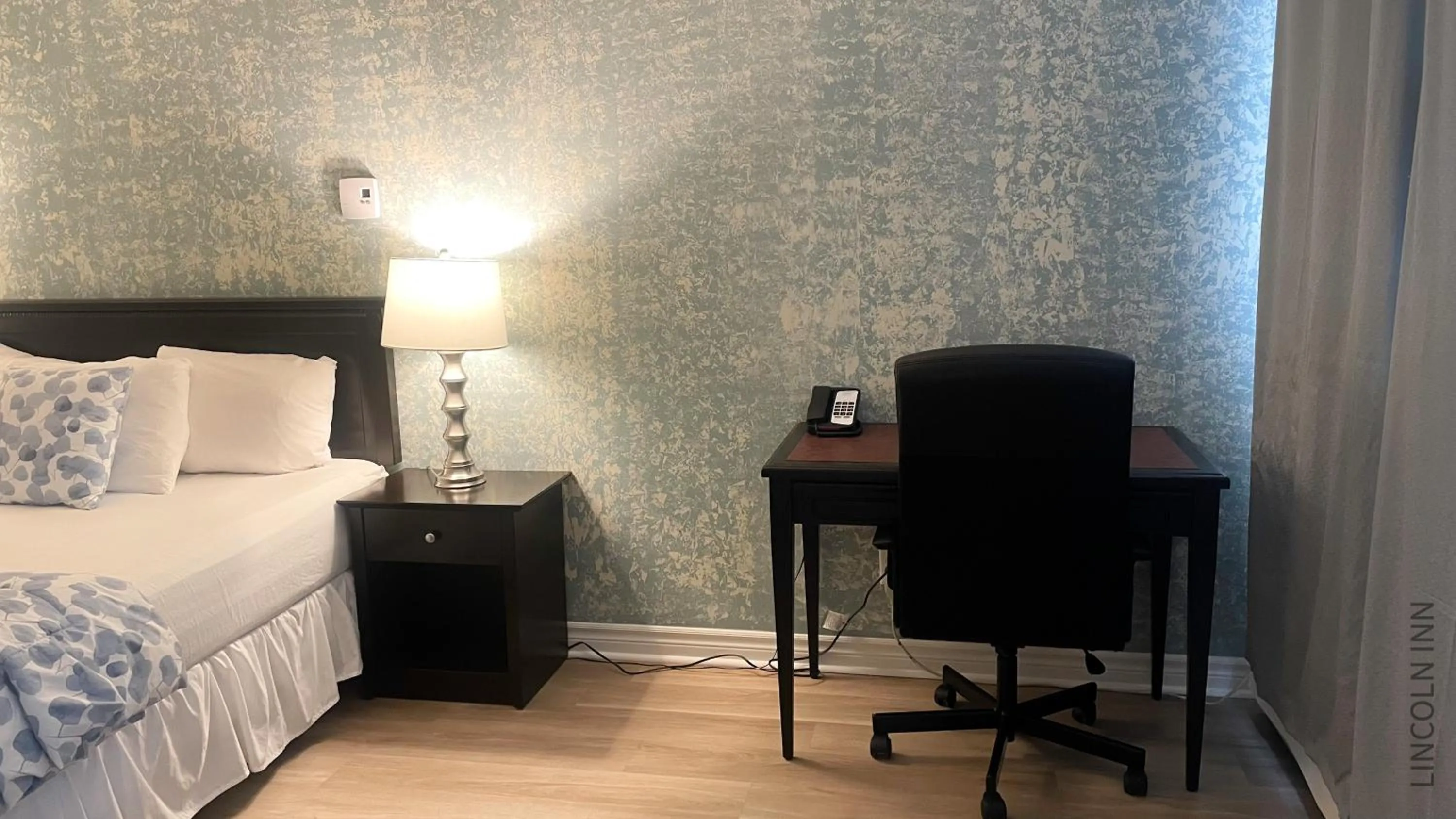 Bed in Lincoln Inn Fredericton