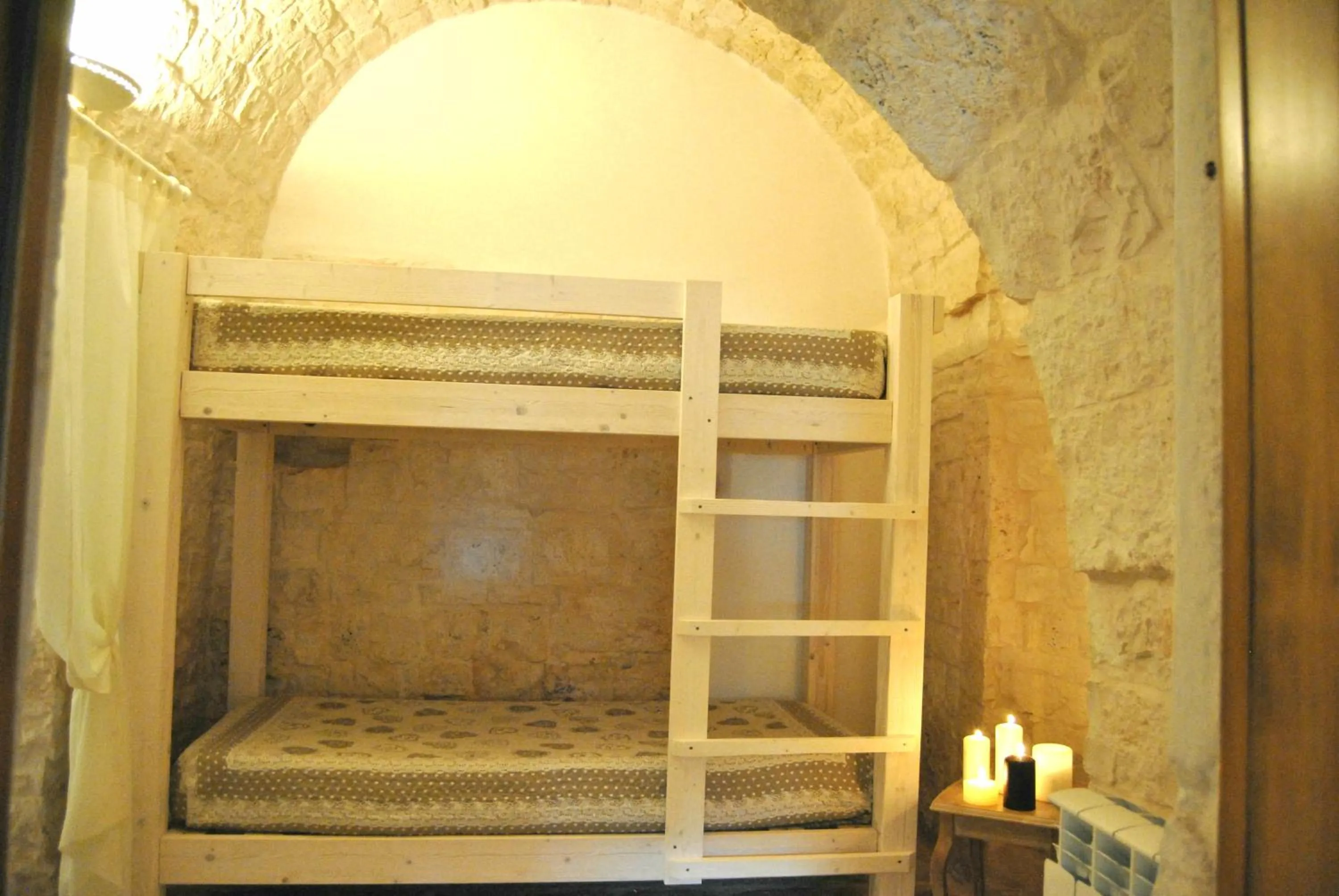 Bed in Trulli Sciummo Relais