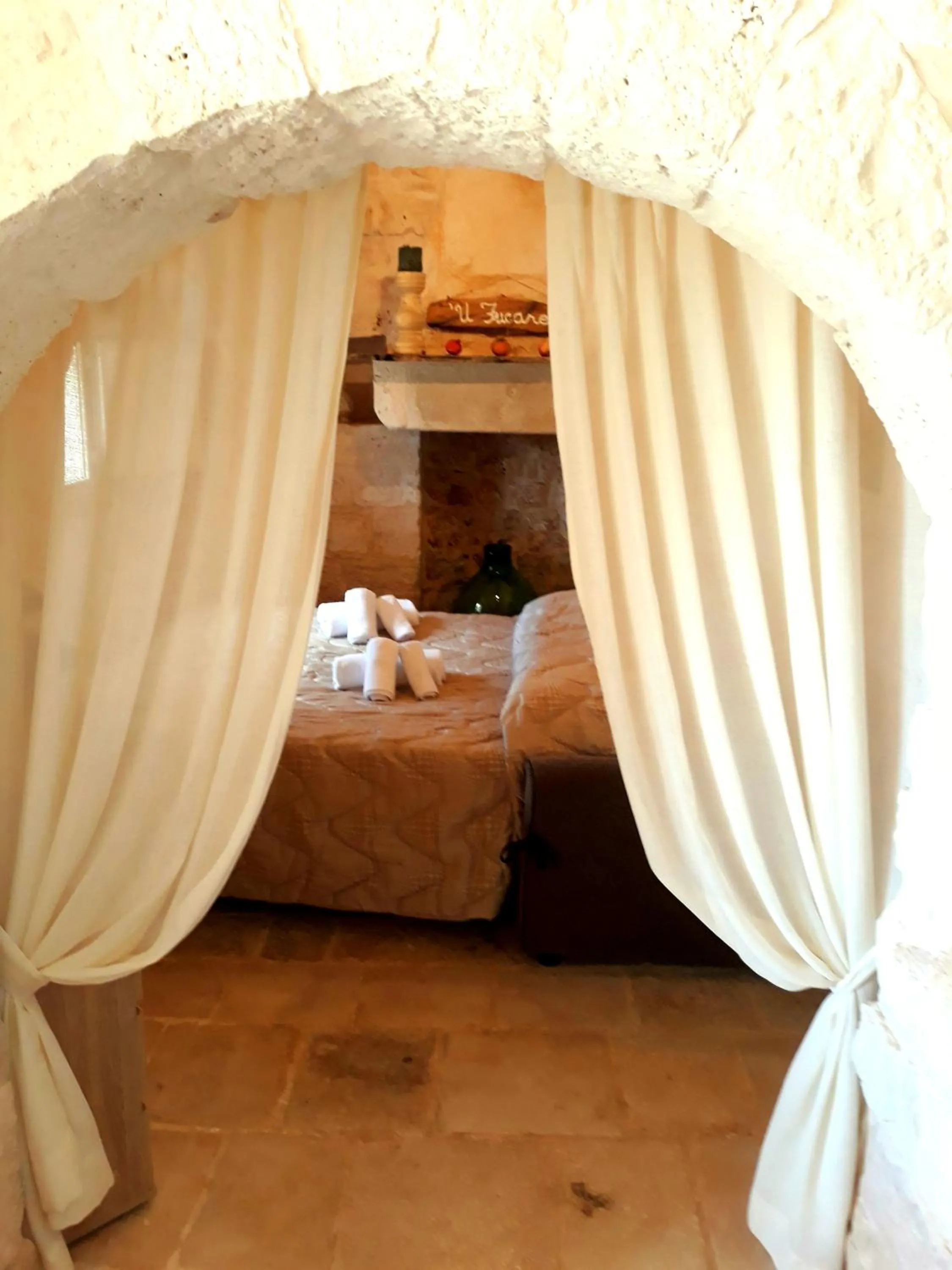 Bed in Trulli Sciummo Relais