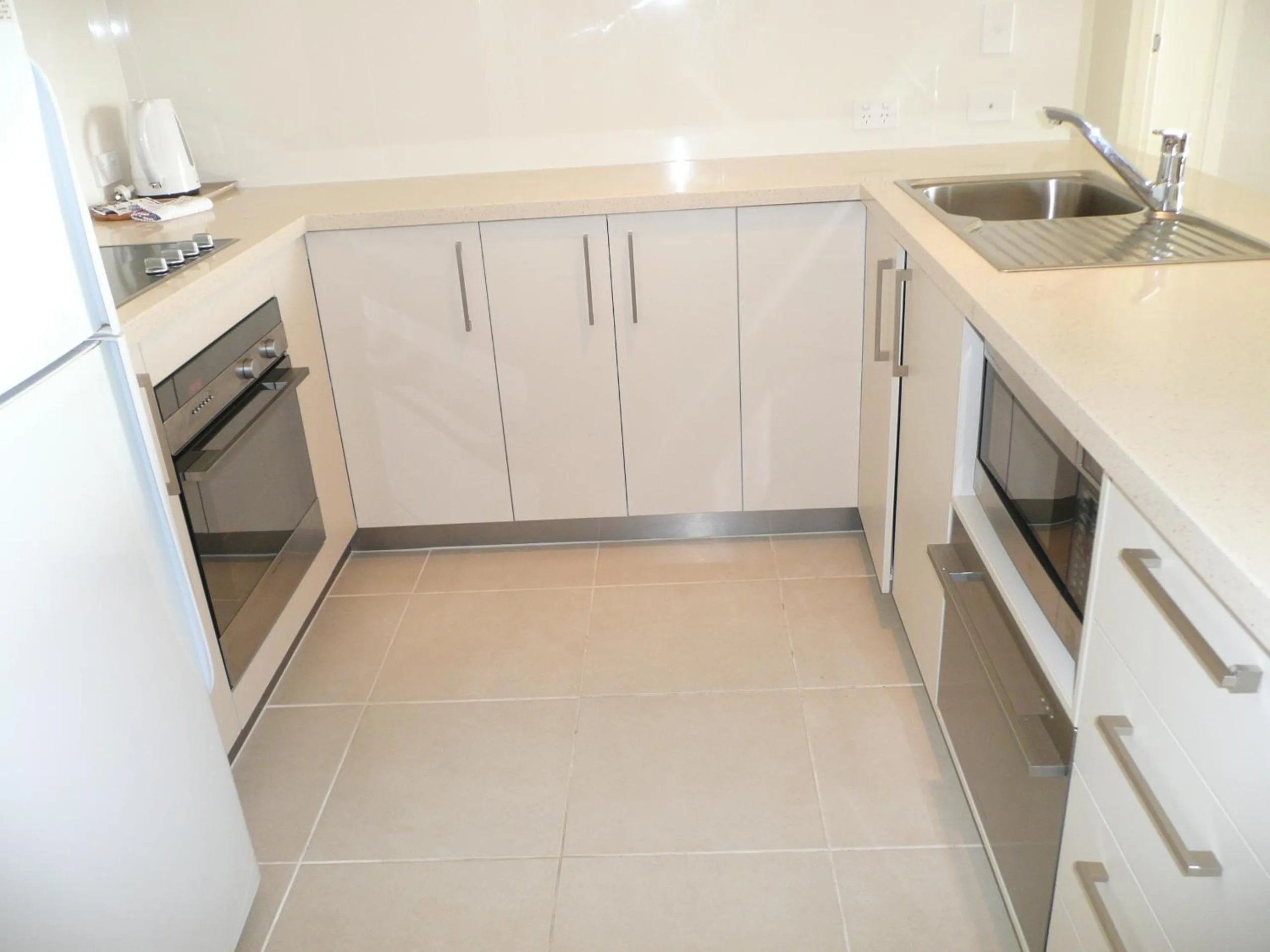 Kitchen or kitchenette in Noosa Harbour Resort