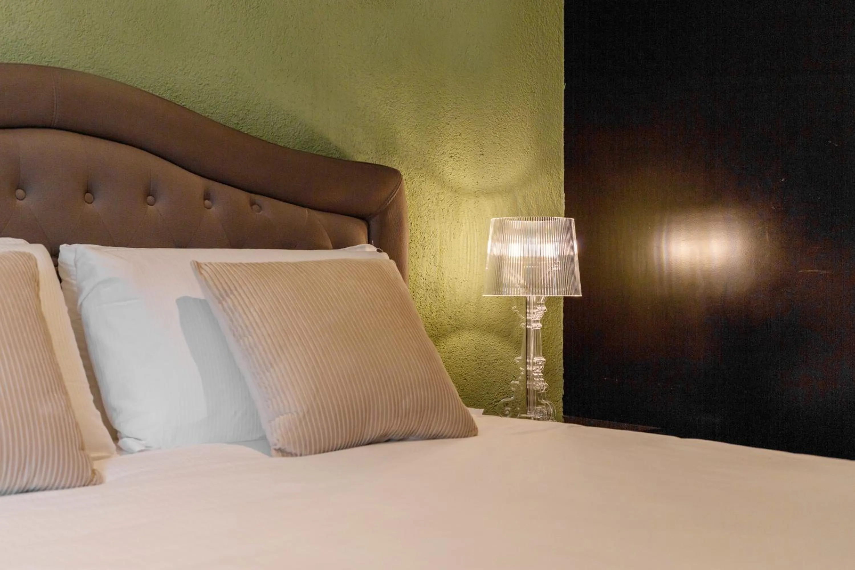 Bed in Martini Rooms Castello