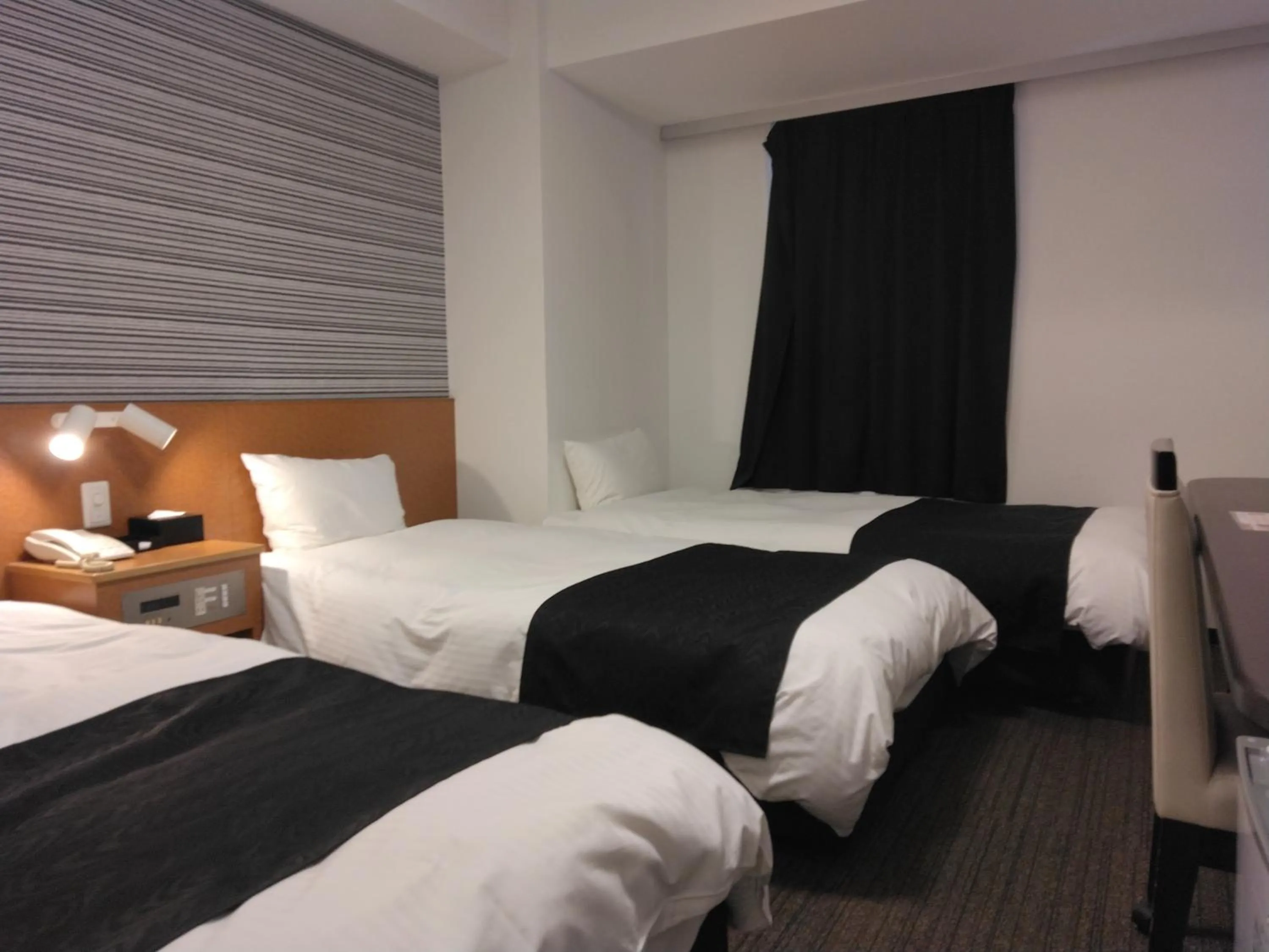 Bed in APA Hotel Hamamatsu Eki Minami