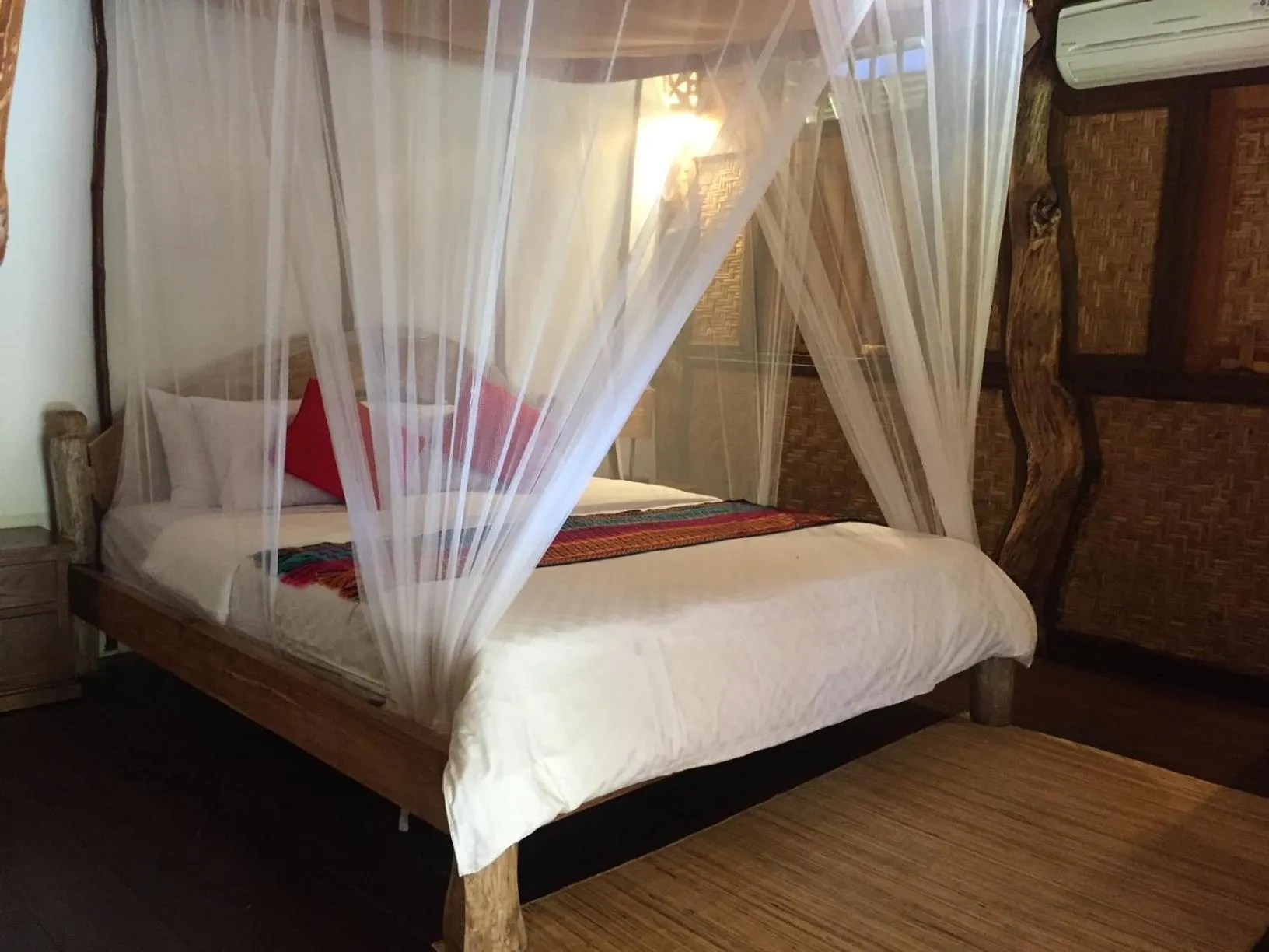 Bed in Flower Bud Bungalow Balangan