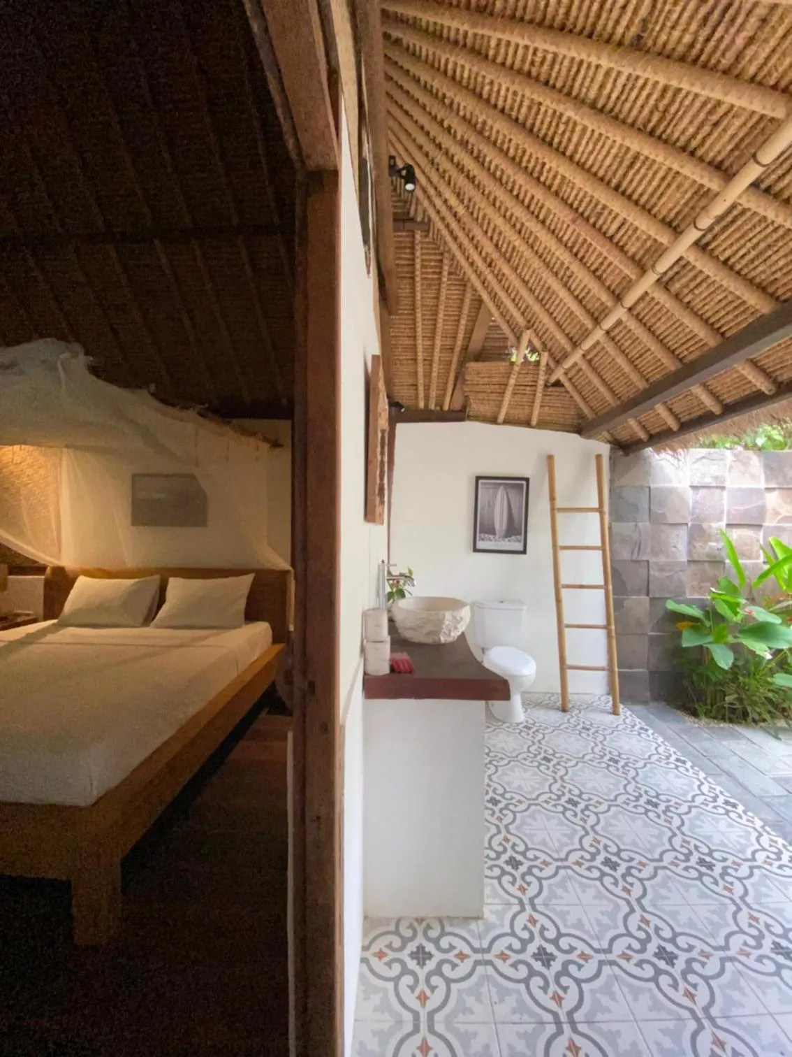 Bed in Flower Bud Bungalow Balangan