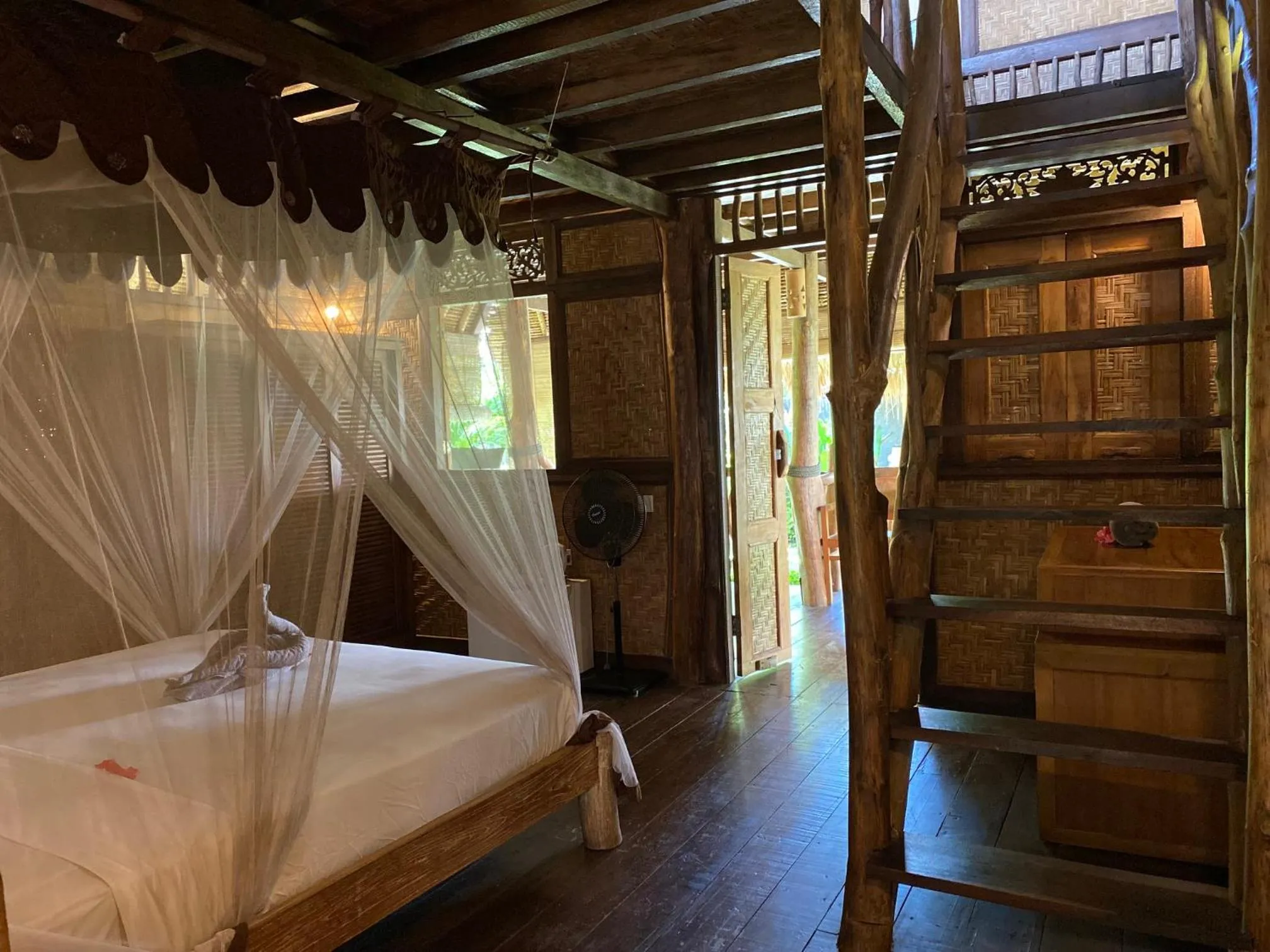 Bed in Flower Bud Bungalow Balangan