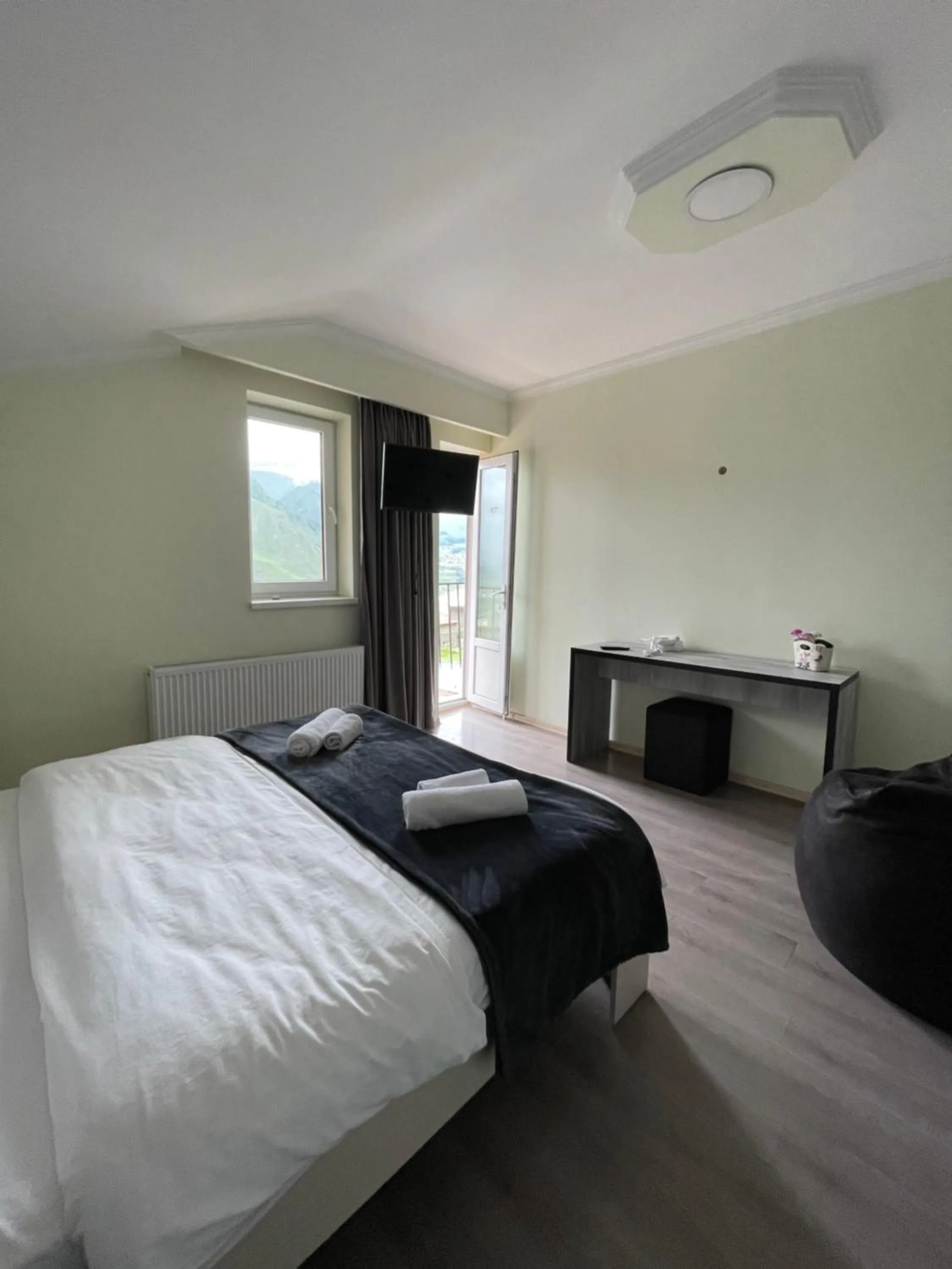 Bed in Hotel NOA Kazbegi