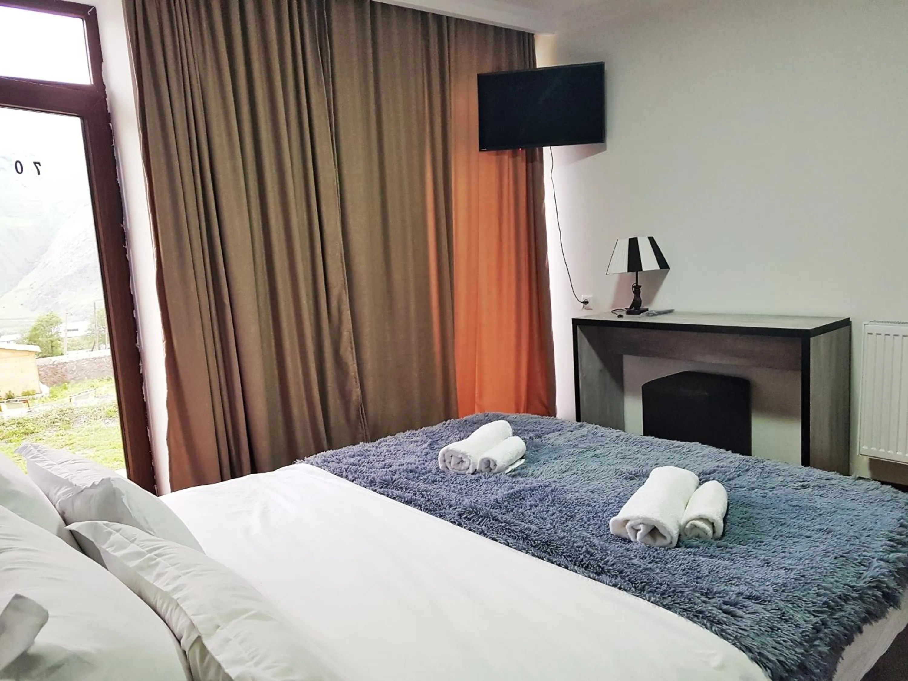 Bed in Hotel NOA Kazbegi