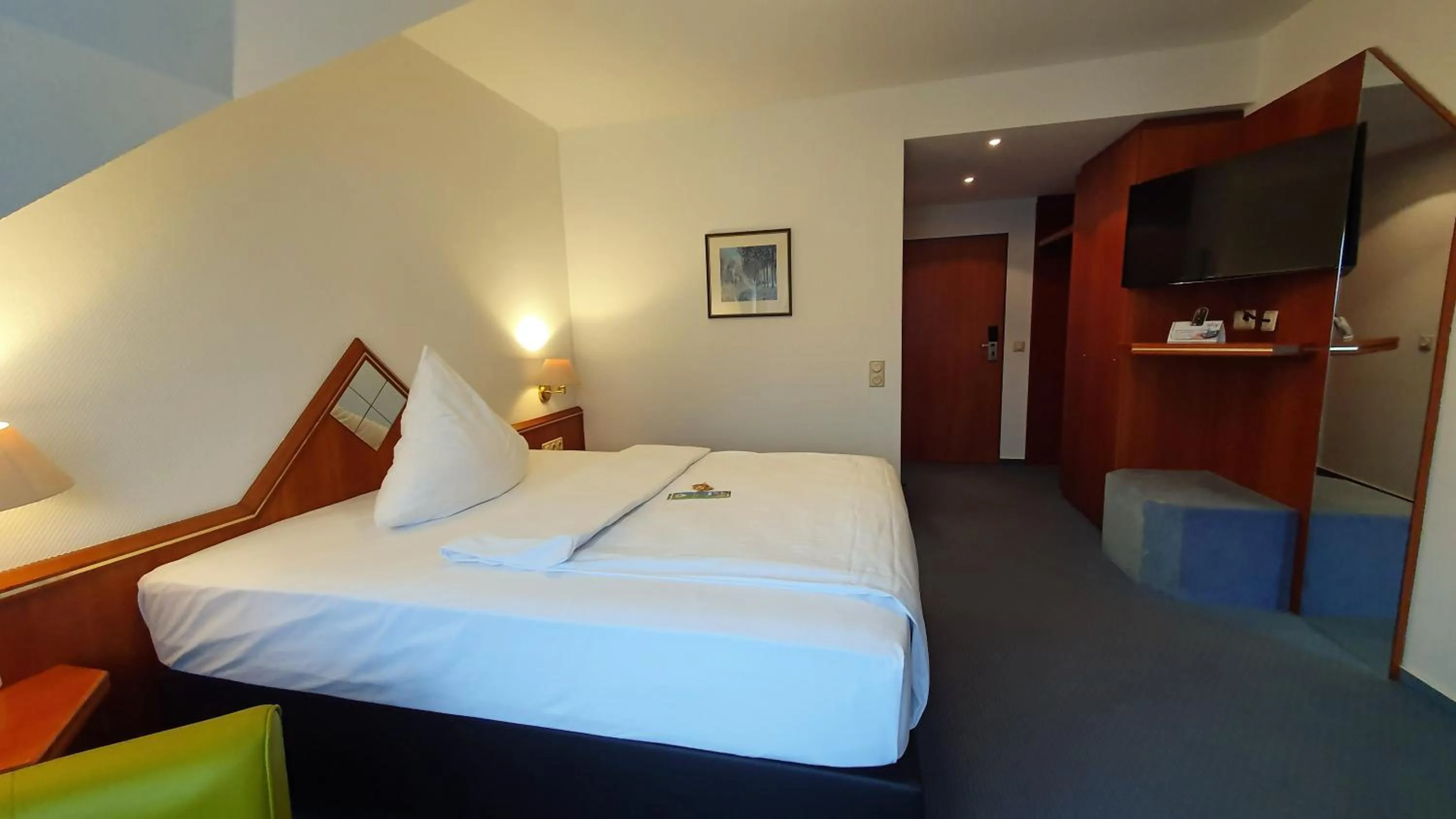 Photo of the whole room, Bed in AKZENT Hotel Merfelder Hof