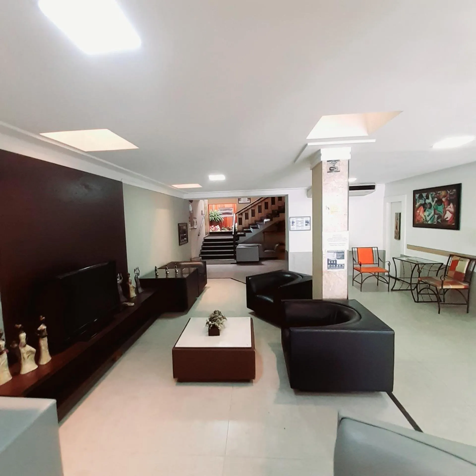 Communal lounge/ TV room in Aton Plaza Hotel