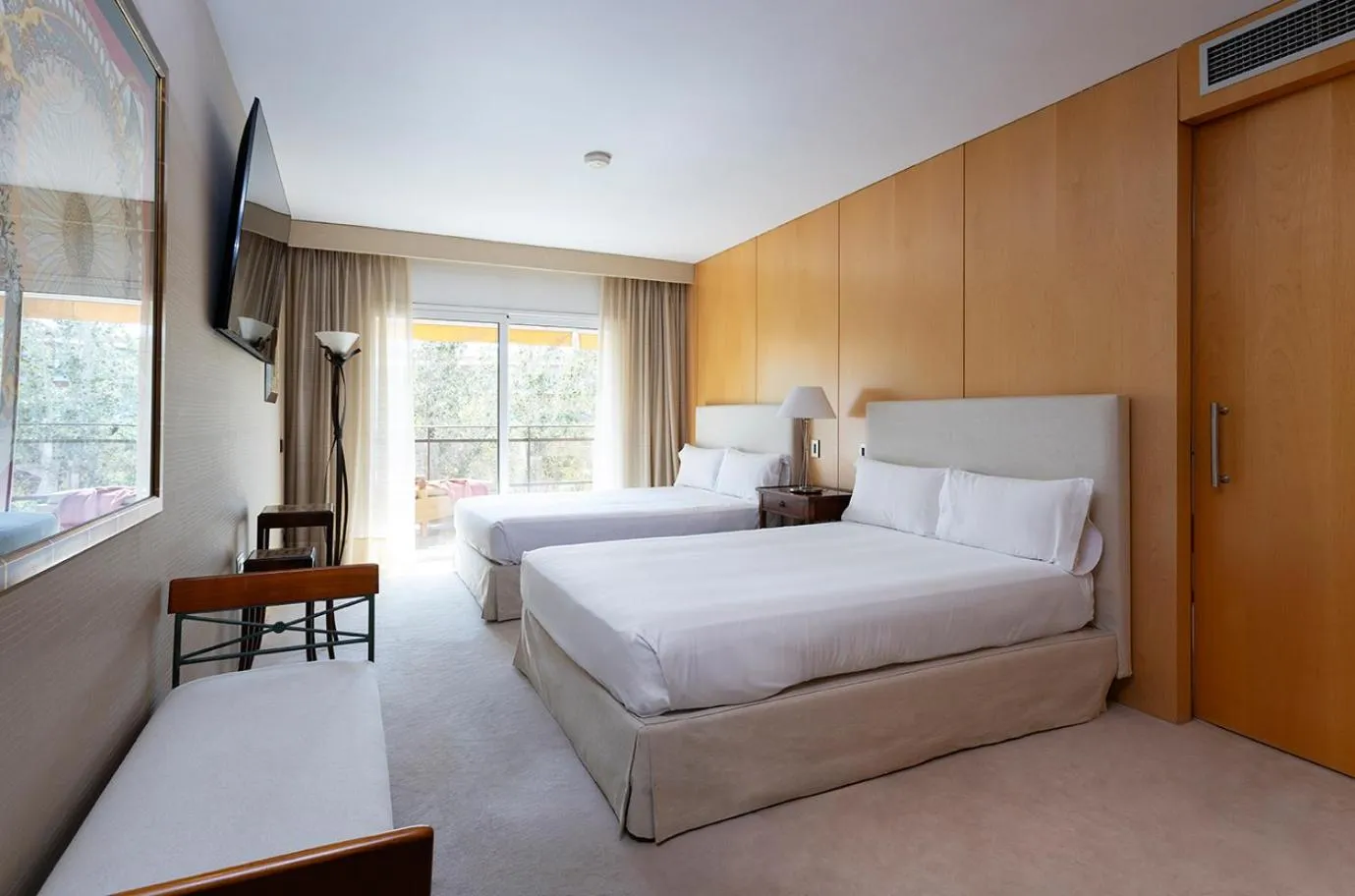 Bed in Suites del Mar Fenals Apartments