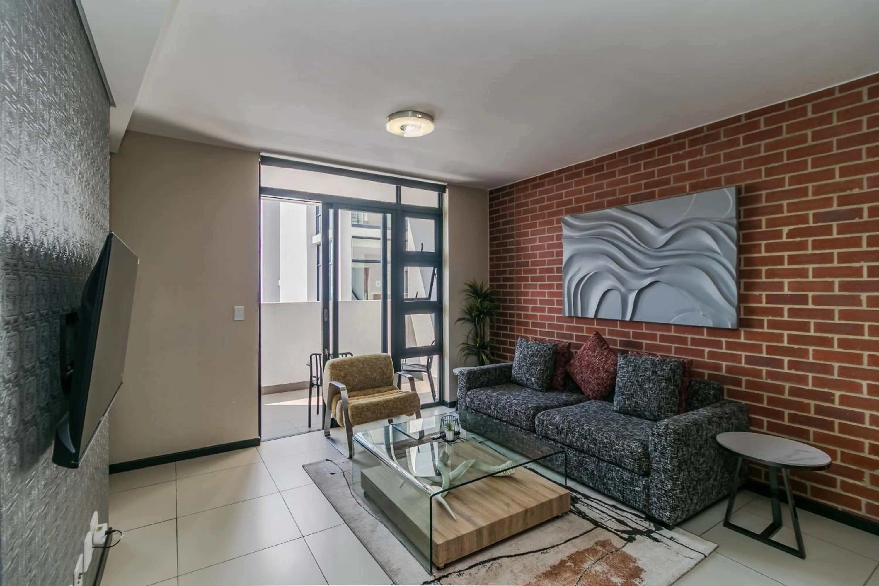 Communal lounge/ TV room in Easy Stay - The Vantage Rosebank