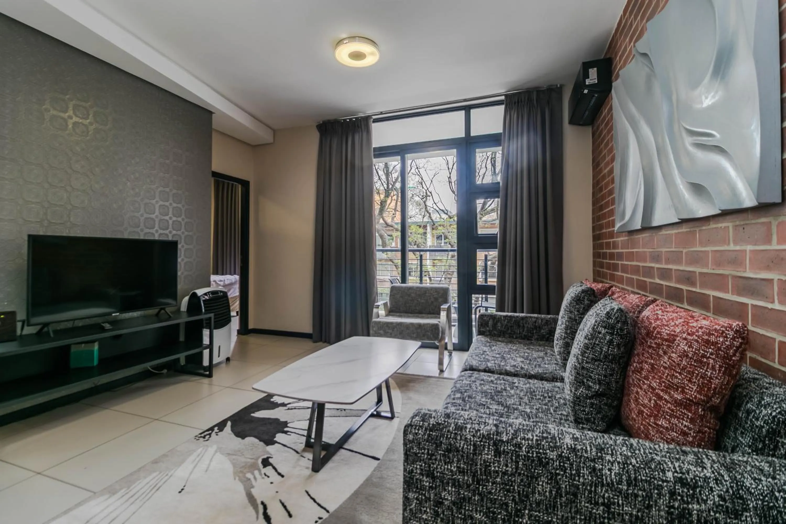 Communal lounge/ TV room in Easy Stay - The Vantage Rosebank