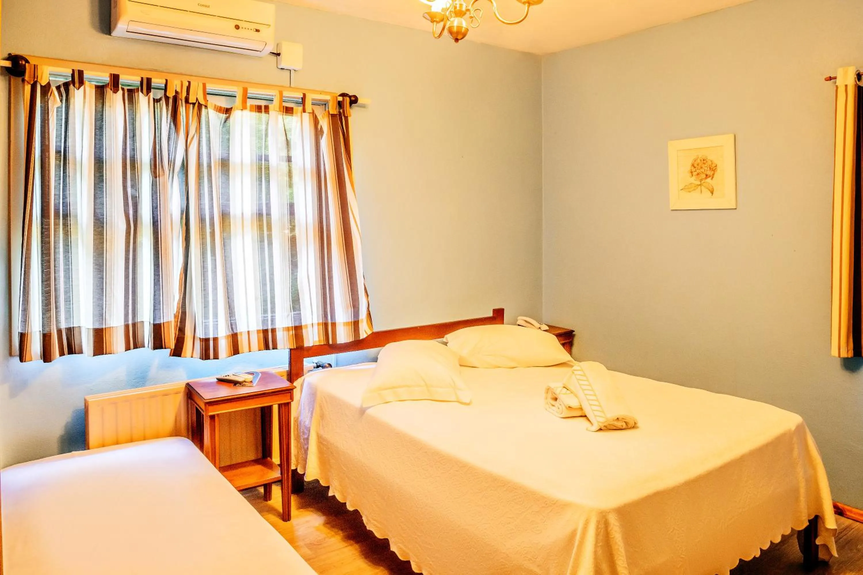 Bed in Pousada Casa Rosa