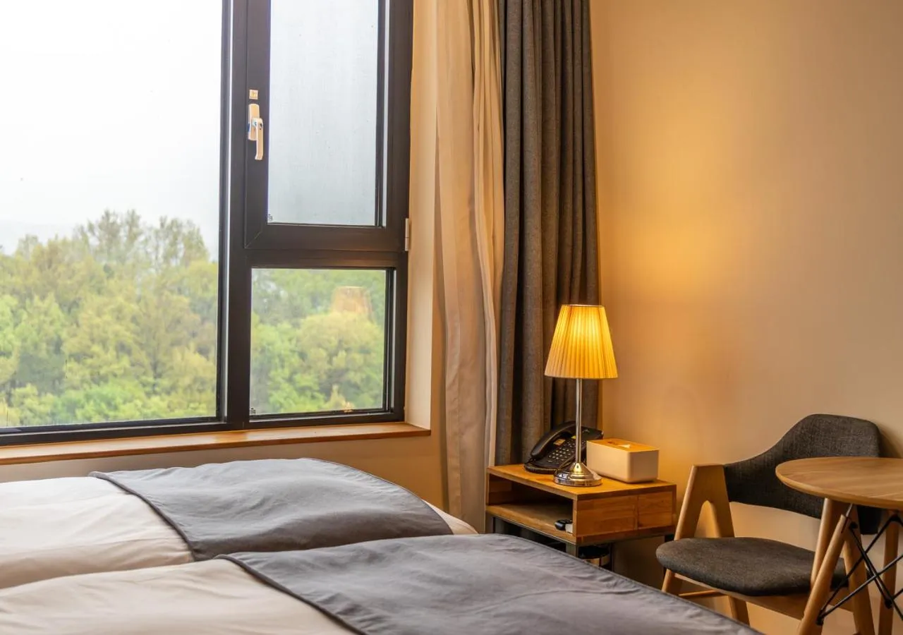 Bedroom, Bed in JK Blossom Hotel