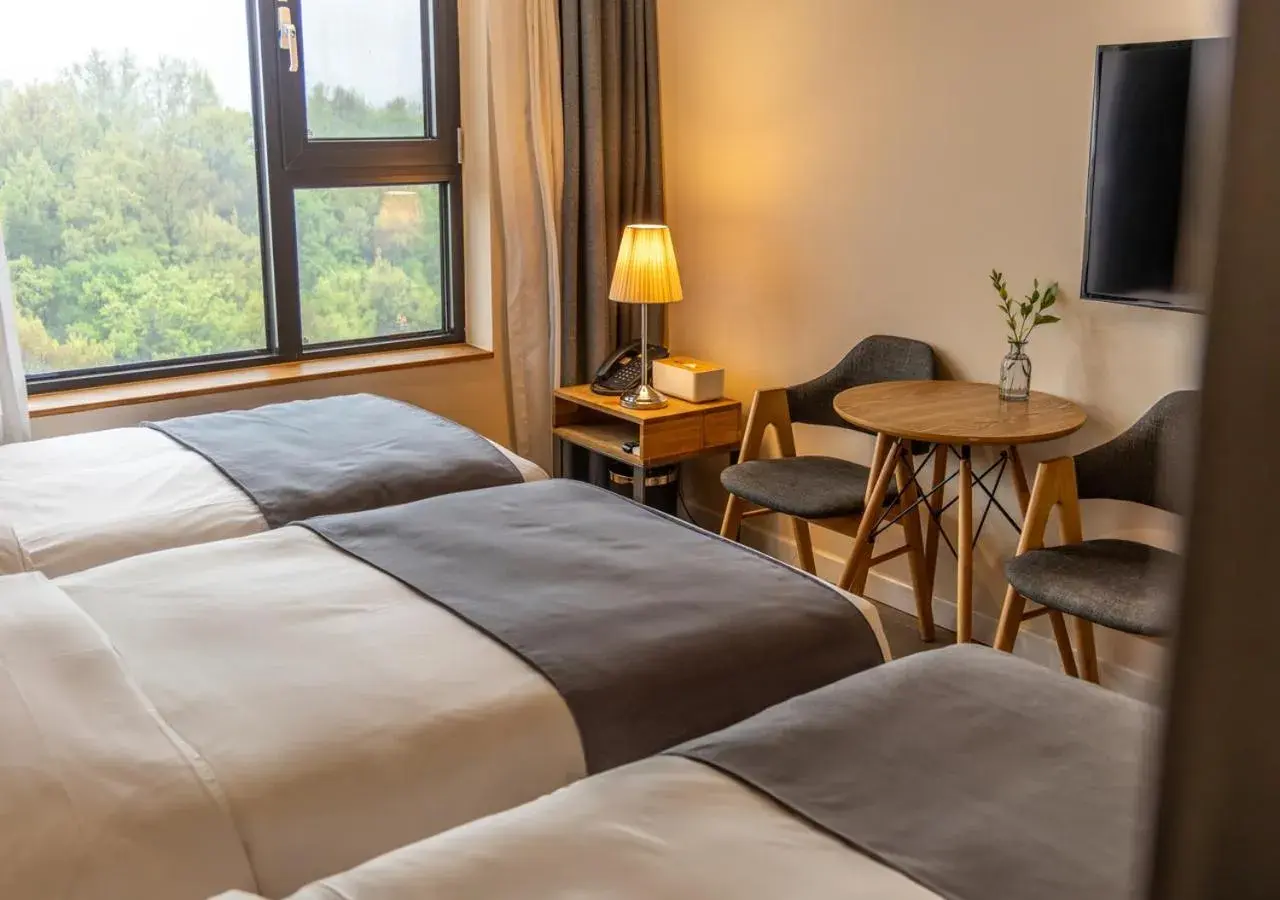 Bedroom in JK Blossom Hotel Bedroom in JK Blossom Hotel