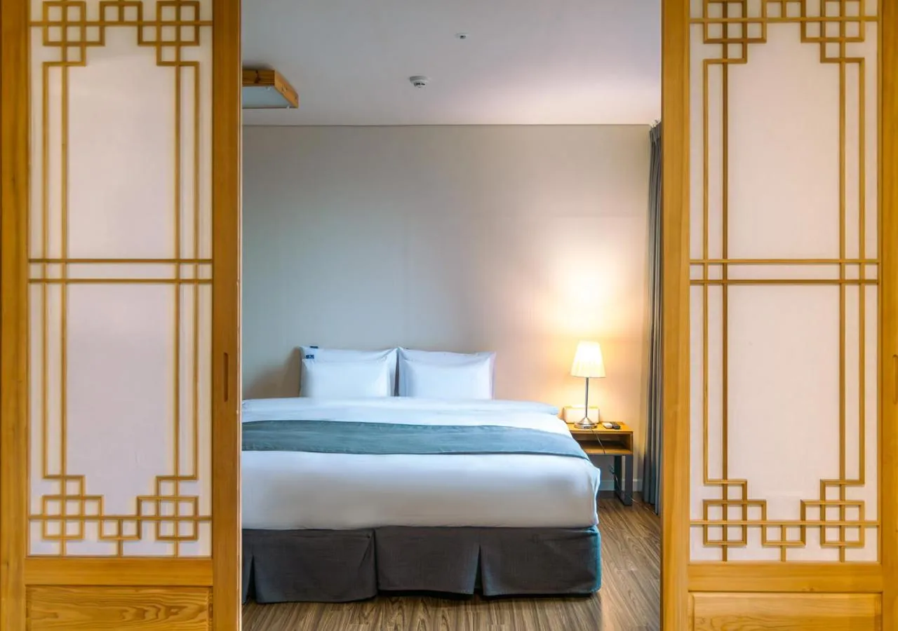 Bed in JK Blossom Hotel