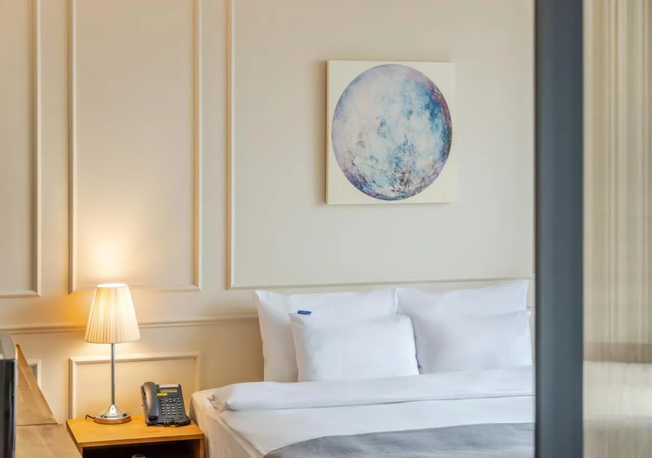 Bed in JK Blossom Hotel