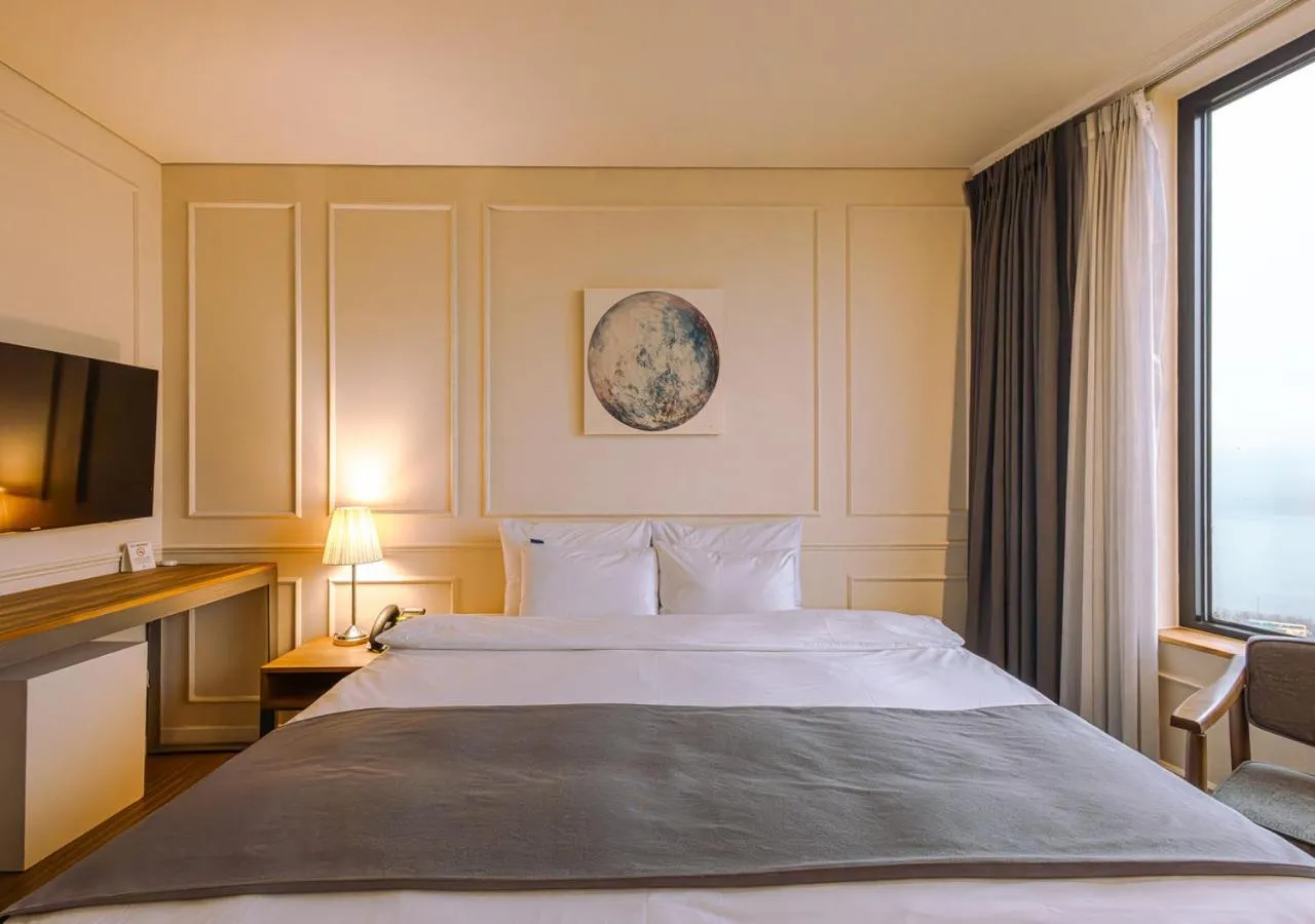 Bed in JK Blossom Hotel