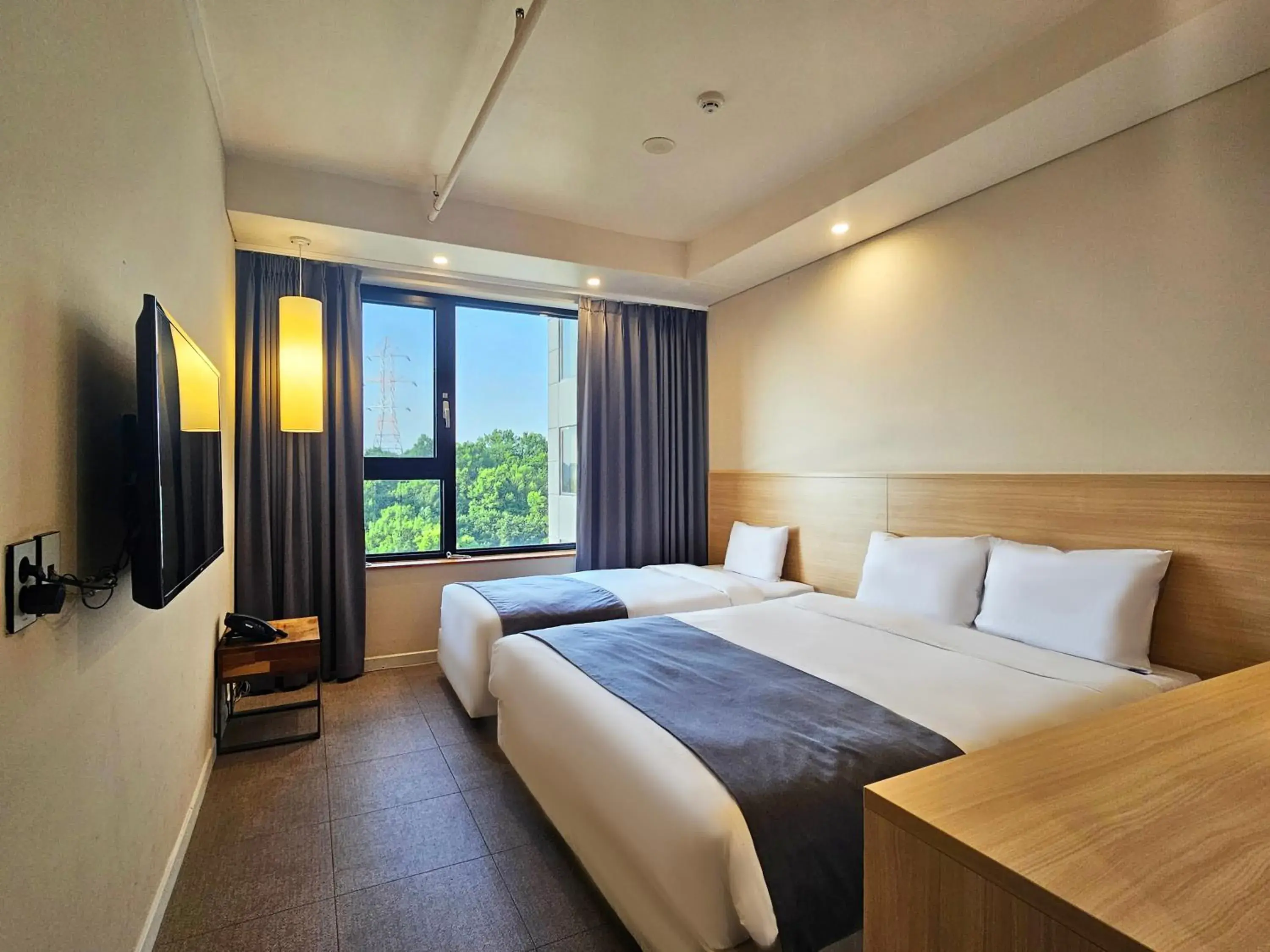 Bedroom, Bed in JK Blossom Hotel Bedroom, Bed in JK Blossom Hotel