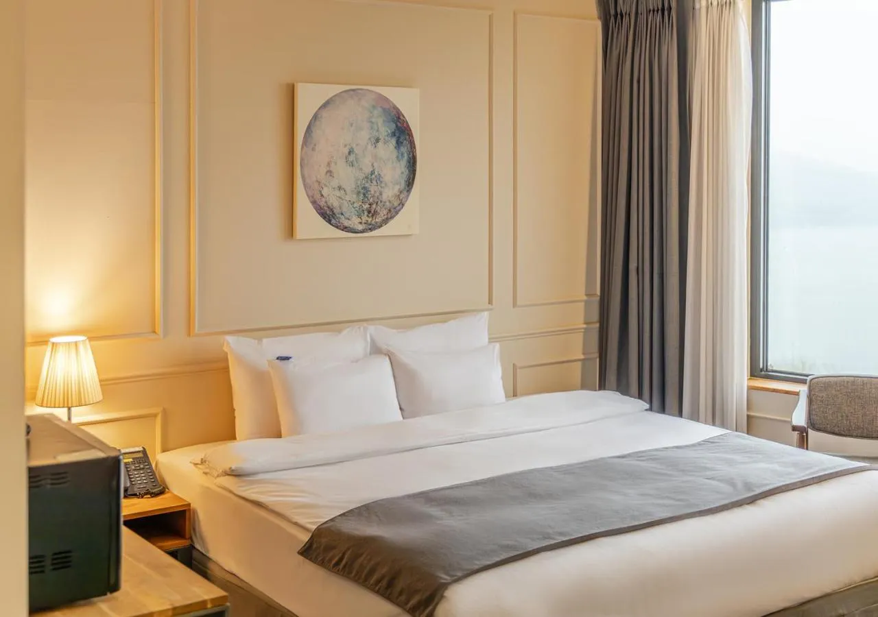 Bed in JK Blossom Hotel