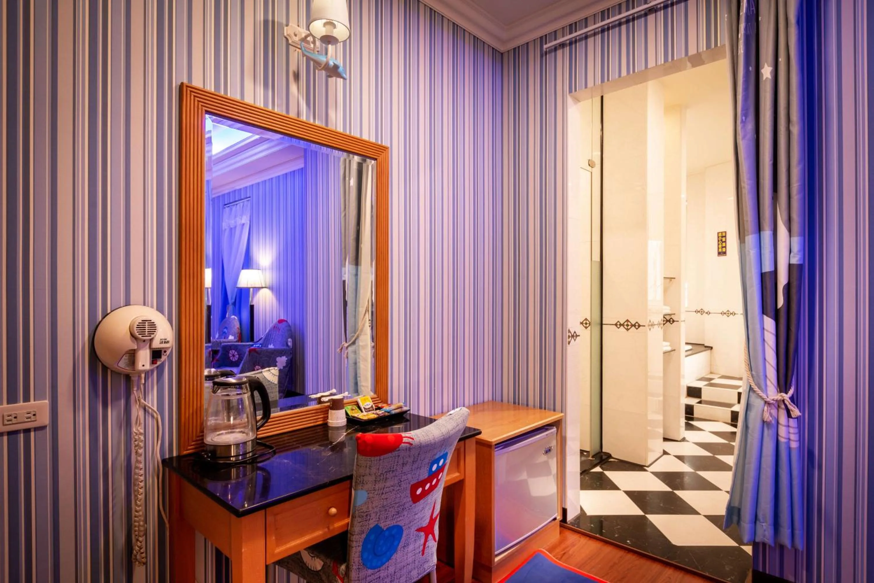 Seating area in 國妃鷹堡時尚健康館King & Princess Motel