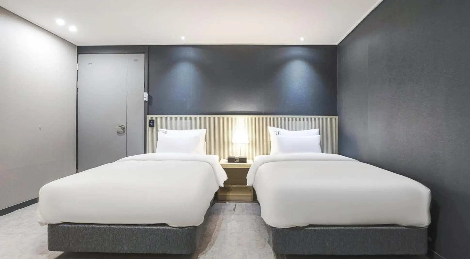 Bed in JJ Hotel Bed in JJ Hotel