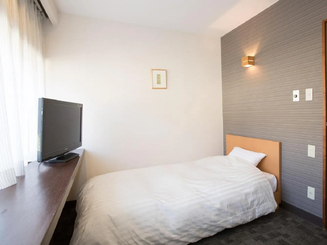 Bed in Itoen Hotel Iizakakanouya