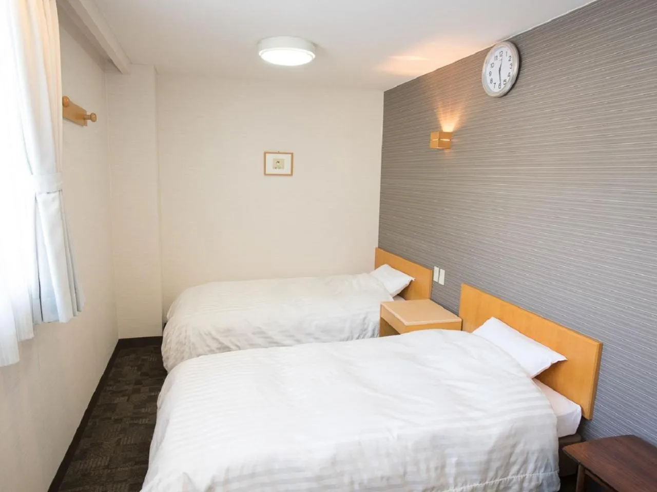 Bed in Itoen Hotel Iizakakanouya