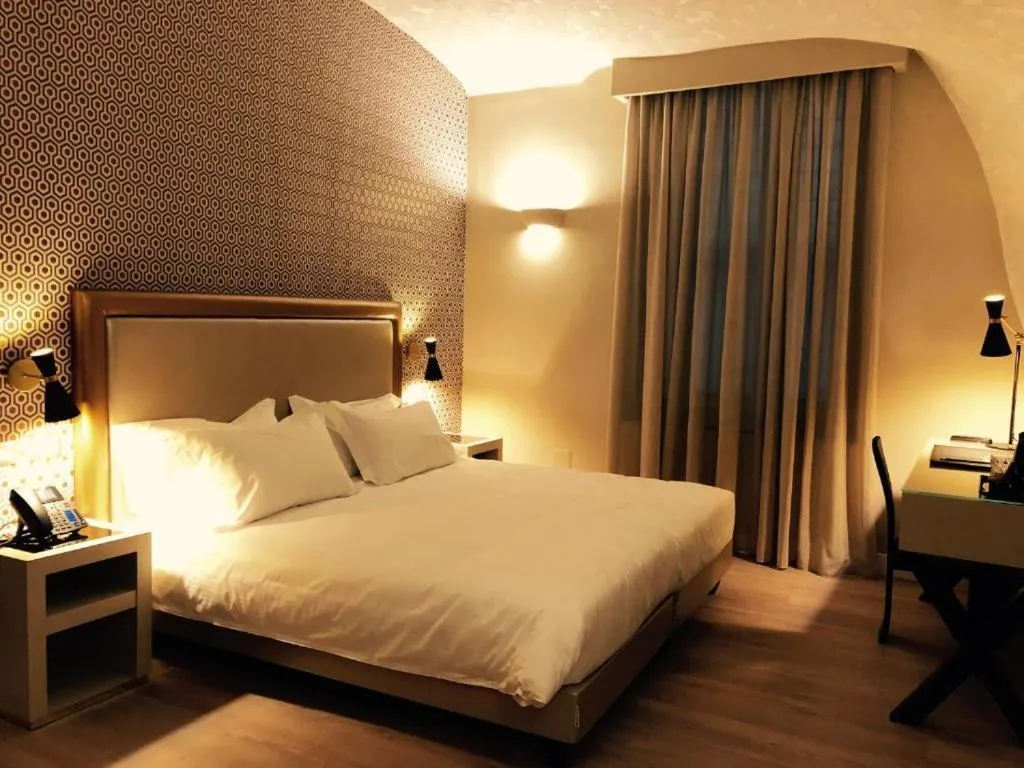 Bed in Caruso Place Luxury Rooms & Suites