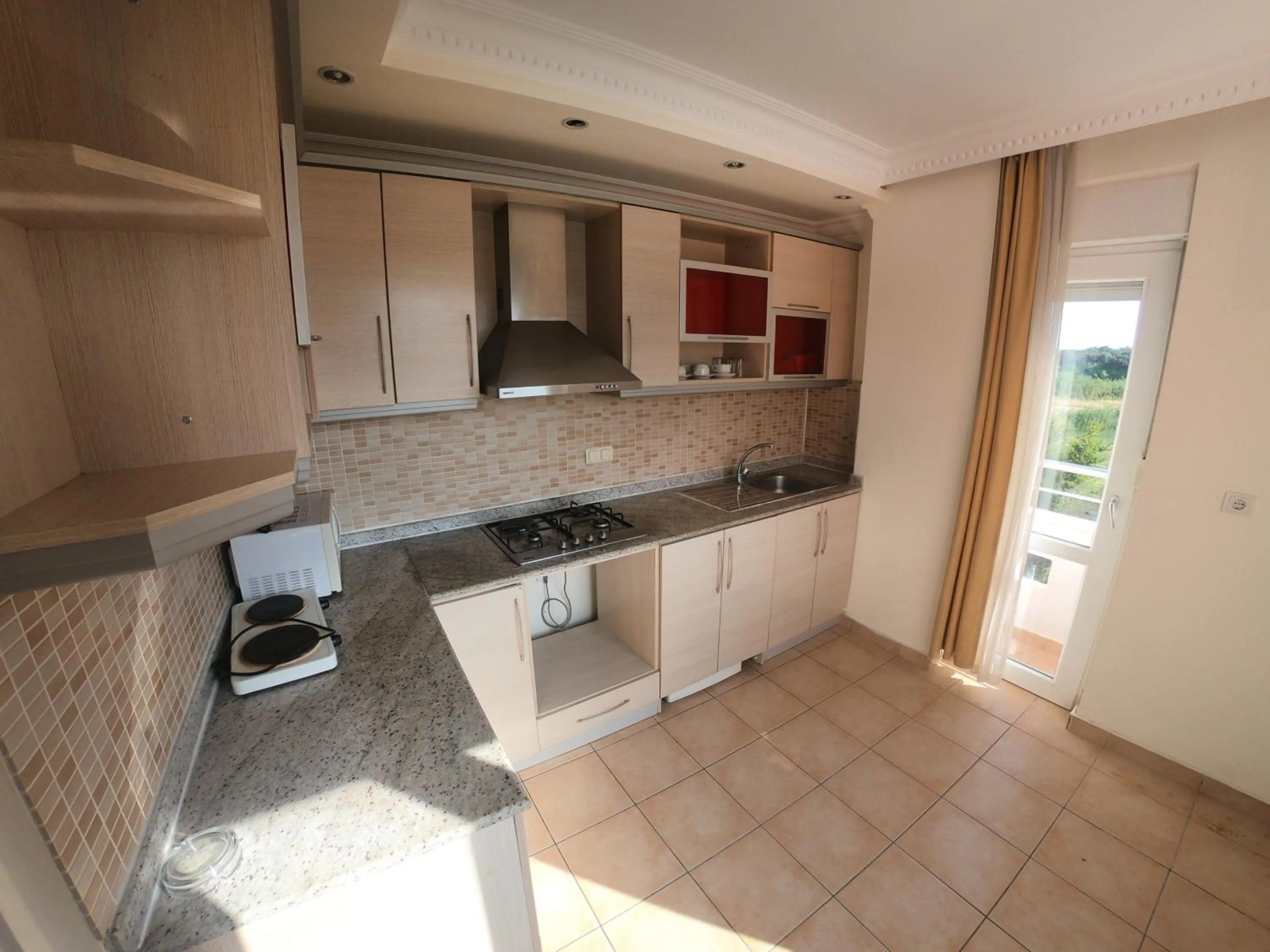 Kitchen or kitchenette in Irem Garden Hotel & Apartments