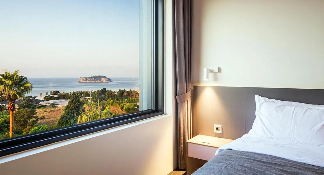 Bed in Jeju Bricks Hotel