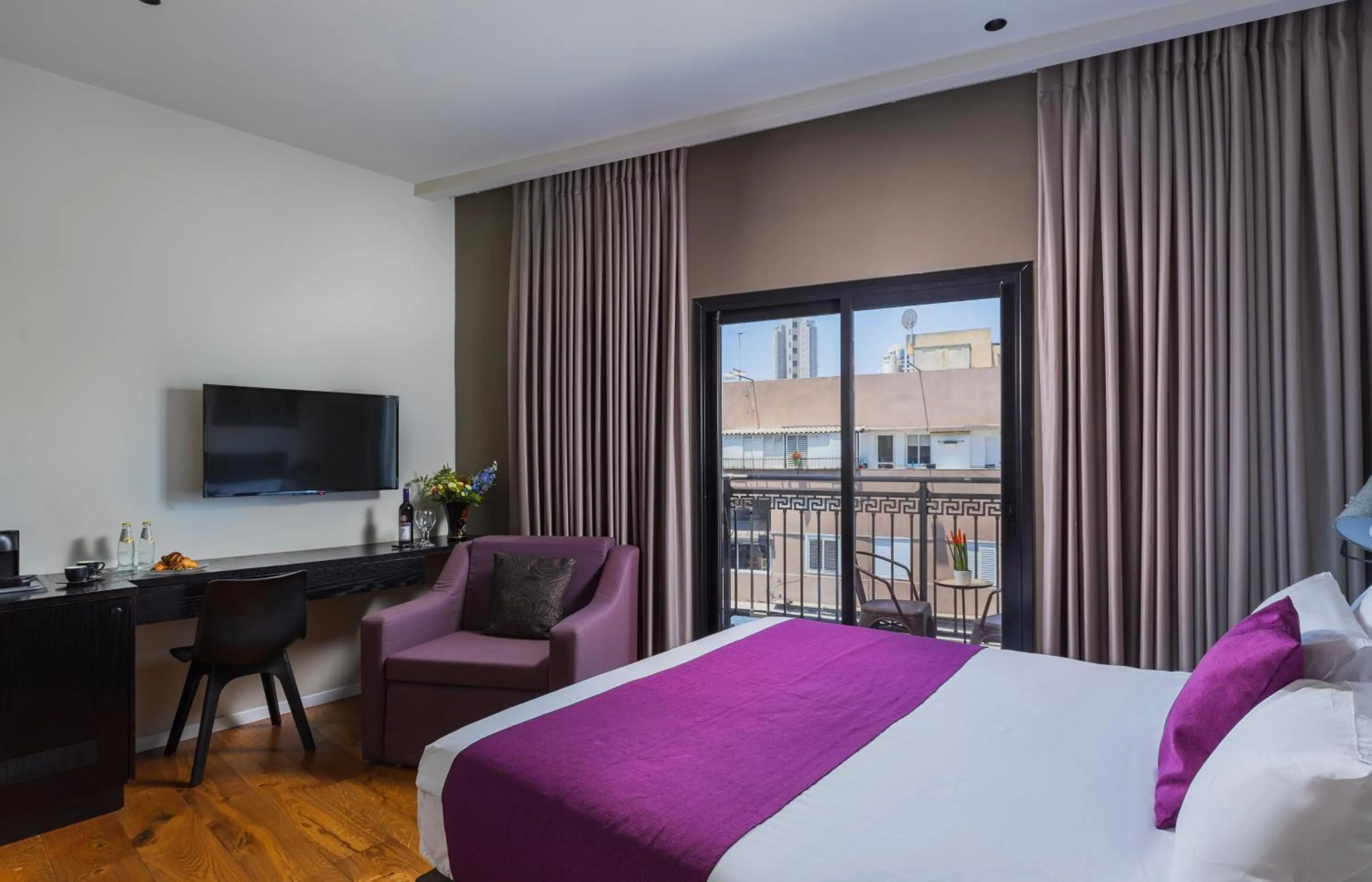 Photo of the whole room, Bed in Kalvin Boutique Hotel by Levinsky Market Tel-Aviv