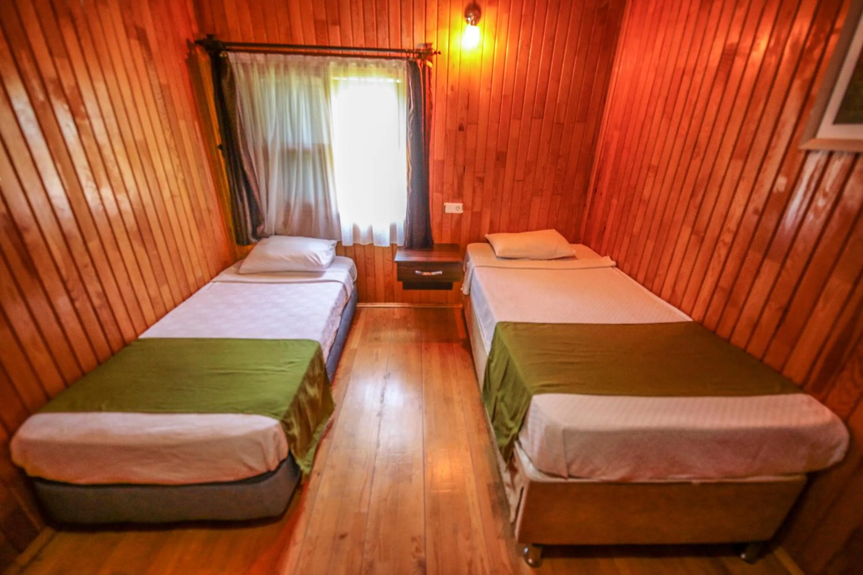 Bed in Cirali Zakkum Bungalow