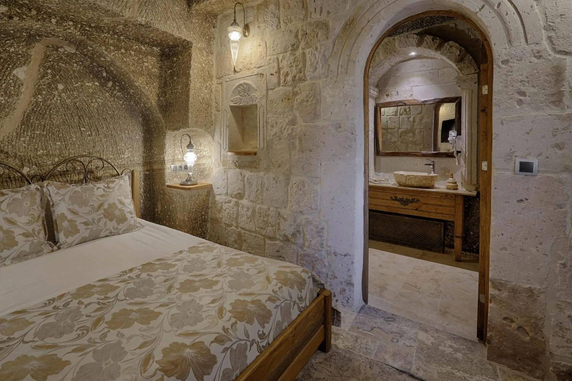 Bed in Hera Cave Suites