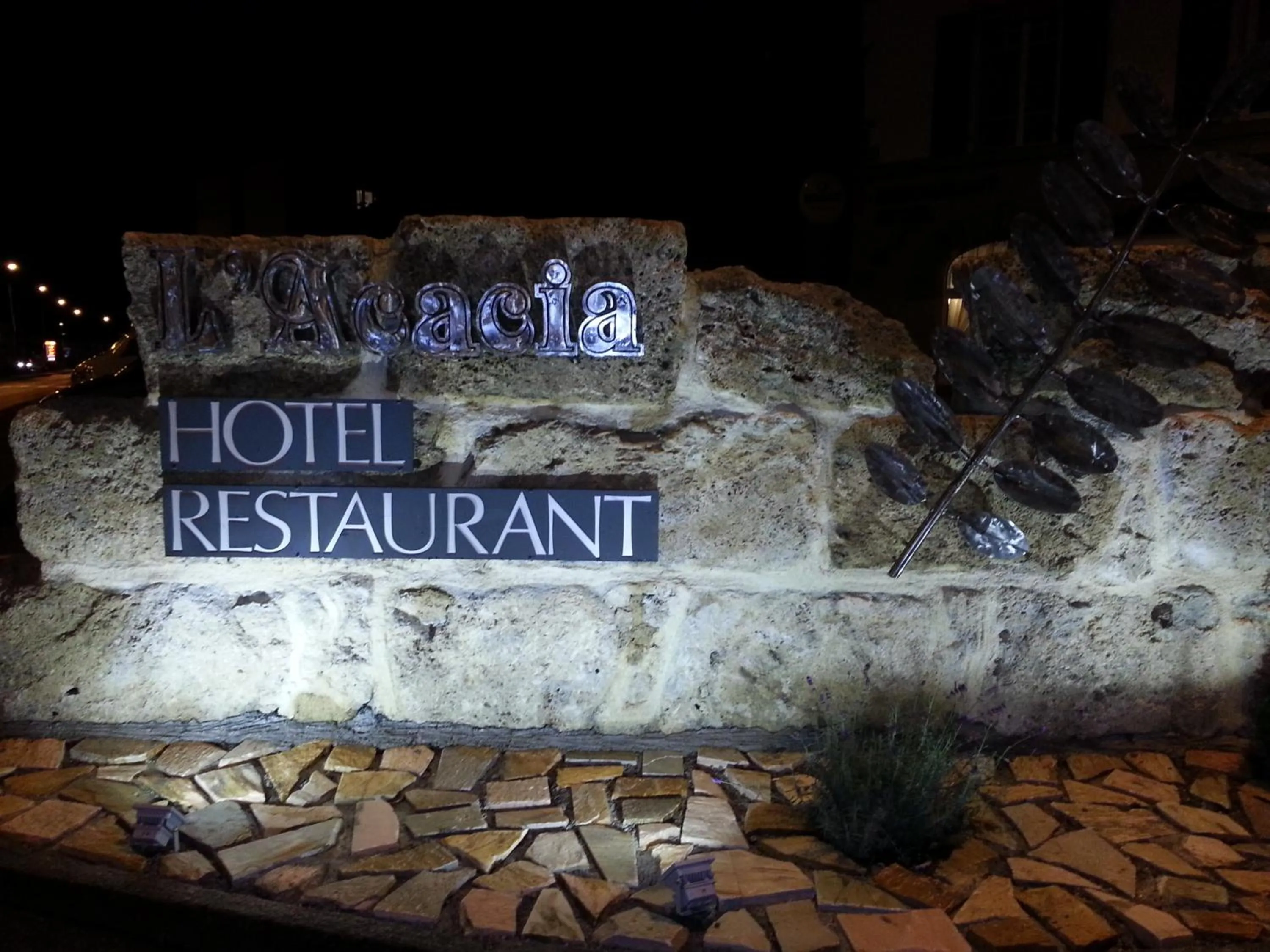 Property logo or sign in Hotel Acacia