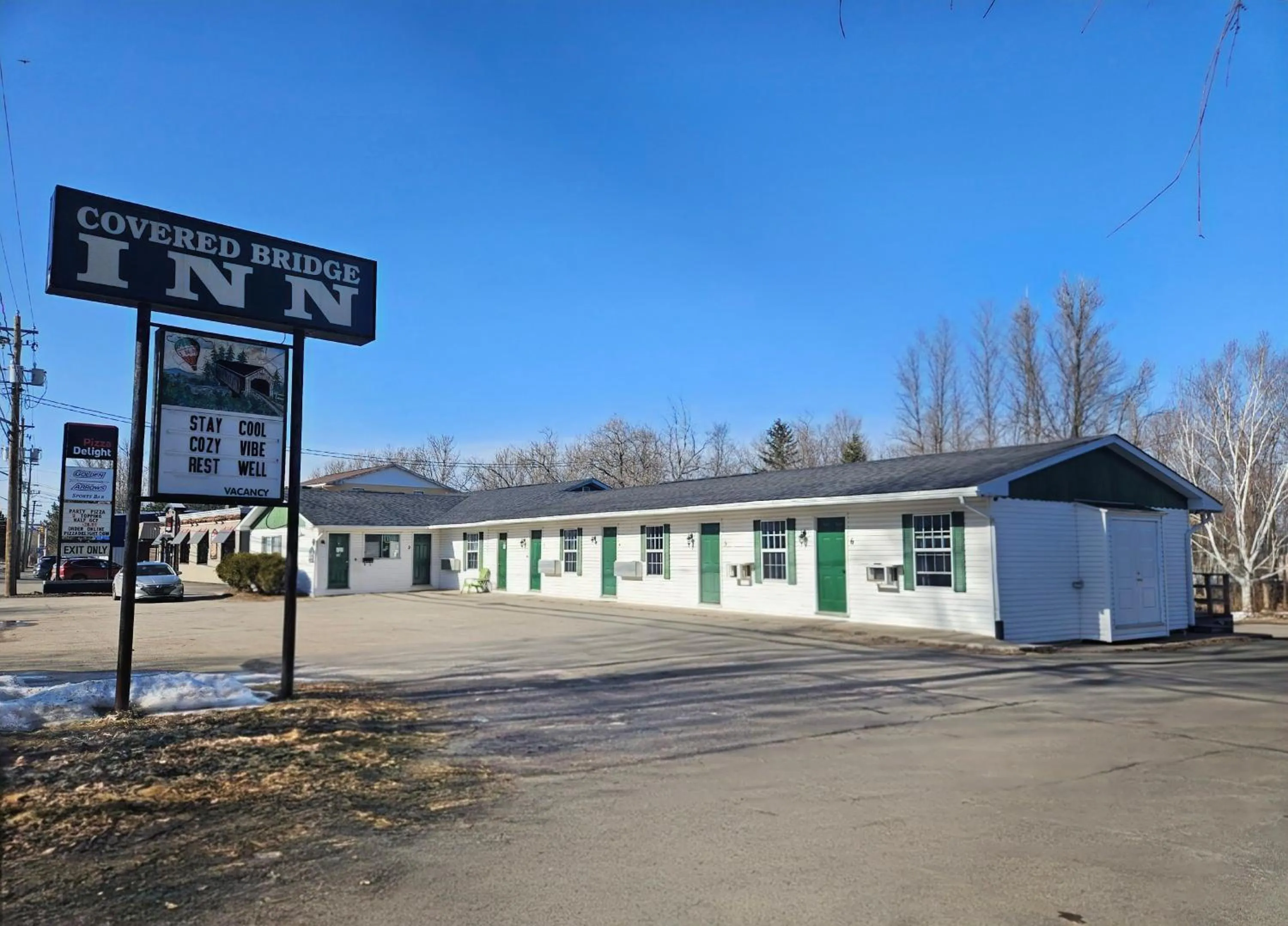 Property building in Covered Bridge Inn & Suites