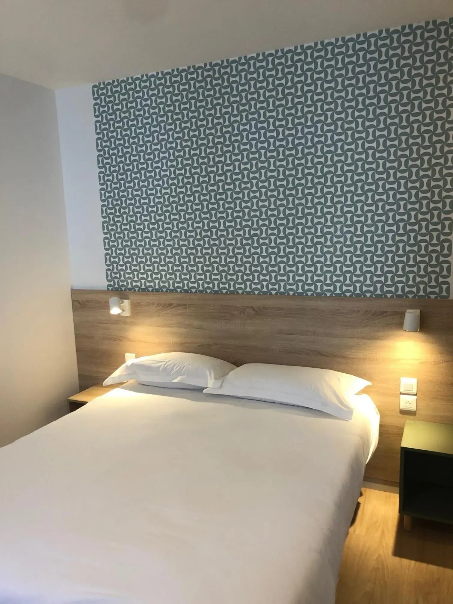 Bed in Hôtel Océan Dinan Bed in Hôtel Océan Dinan